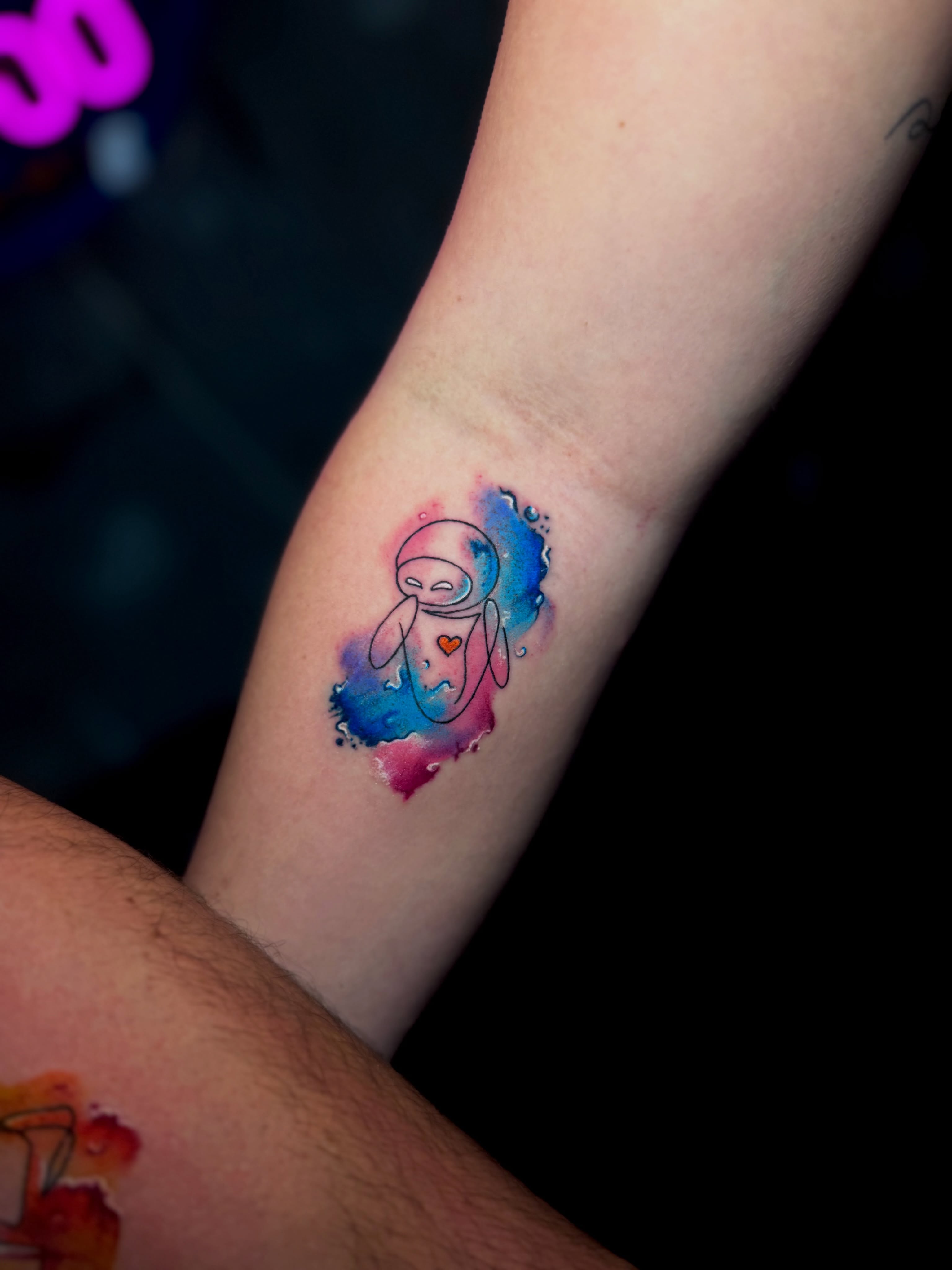 Astronaut watercolor tattoo on the forearm by Keyla Valdes, Miami, Florida