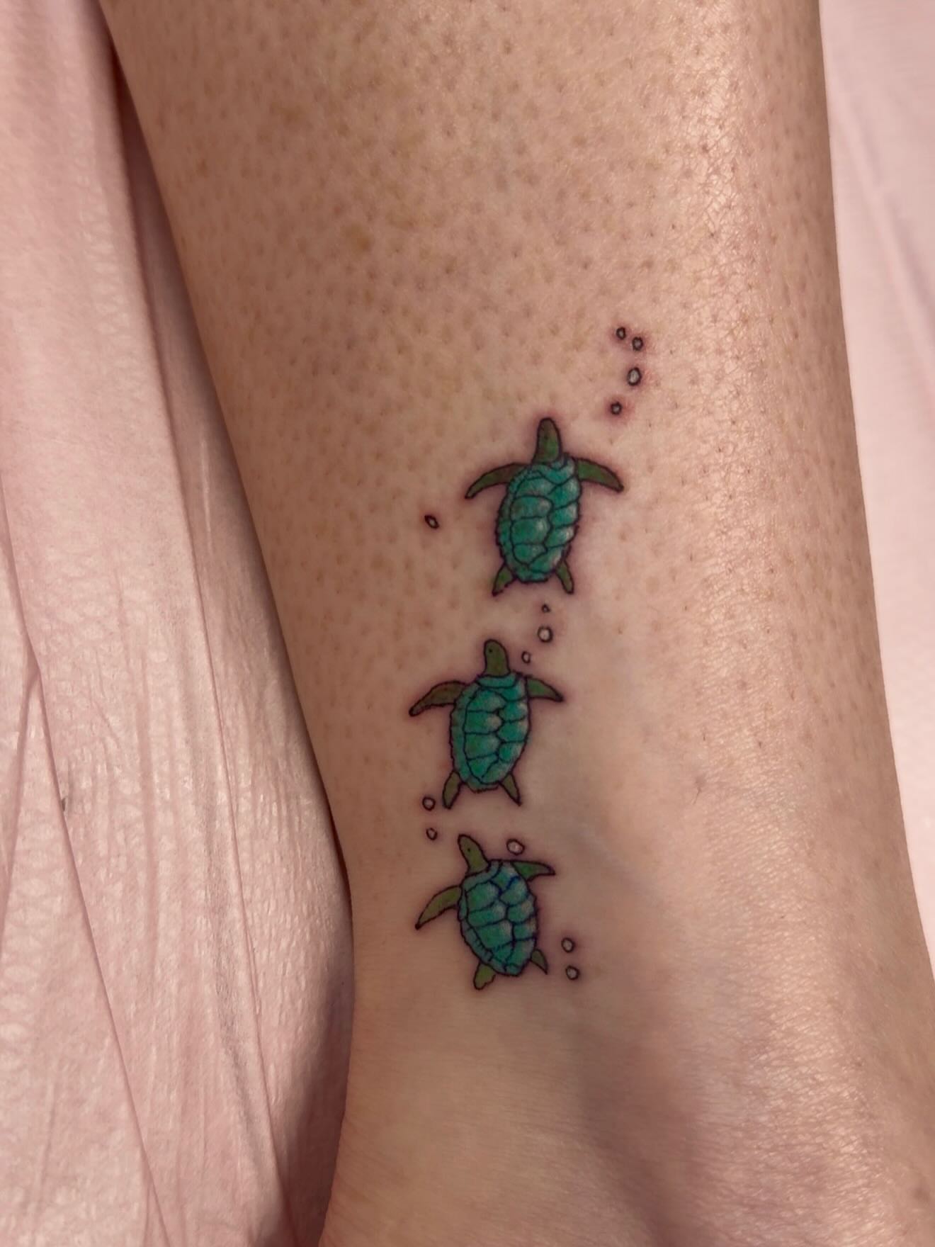 Sea turtles dotwork tattoo on the forearm by Justin Evans kc ink