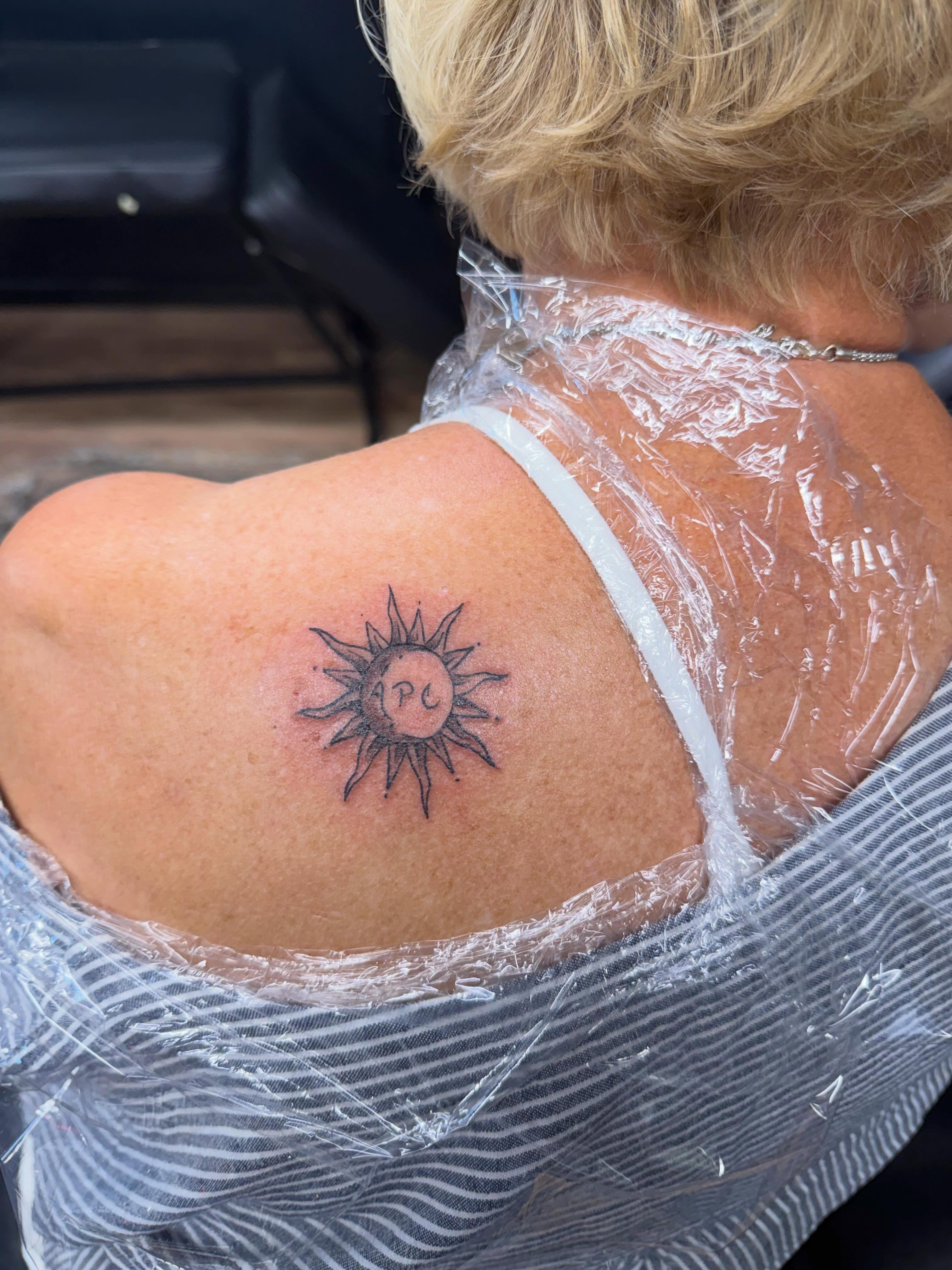 Sun black and grey tattoo on the shoulder by Justin Evans kc ink