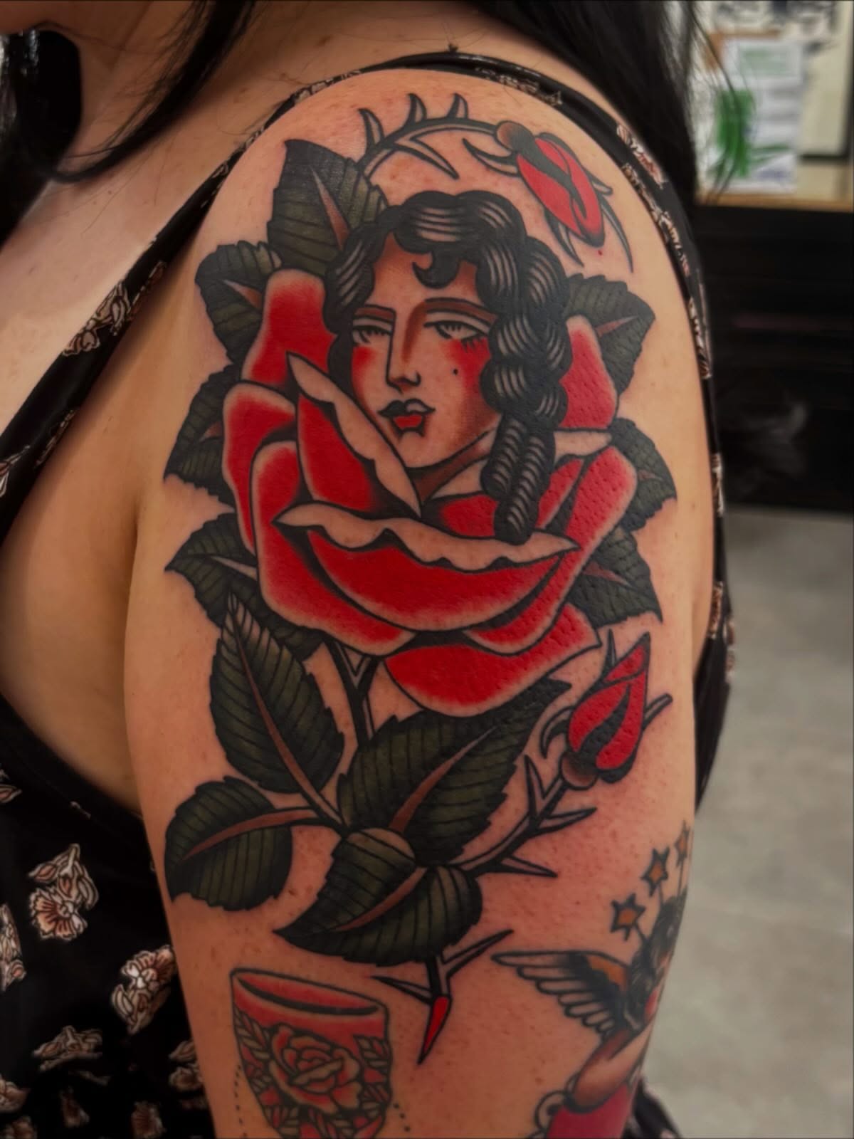 Rose and woman American traditional tattoo on the shoulder by Claire Anderson