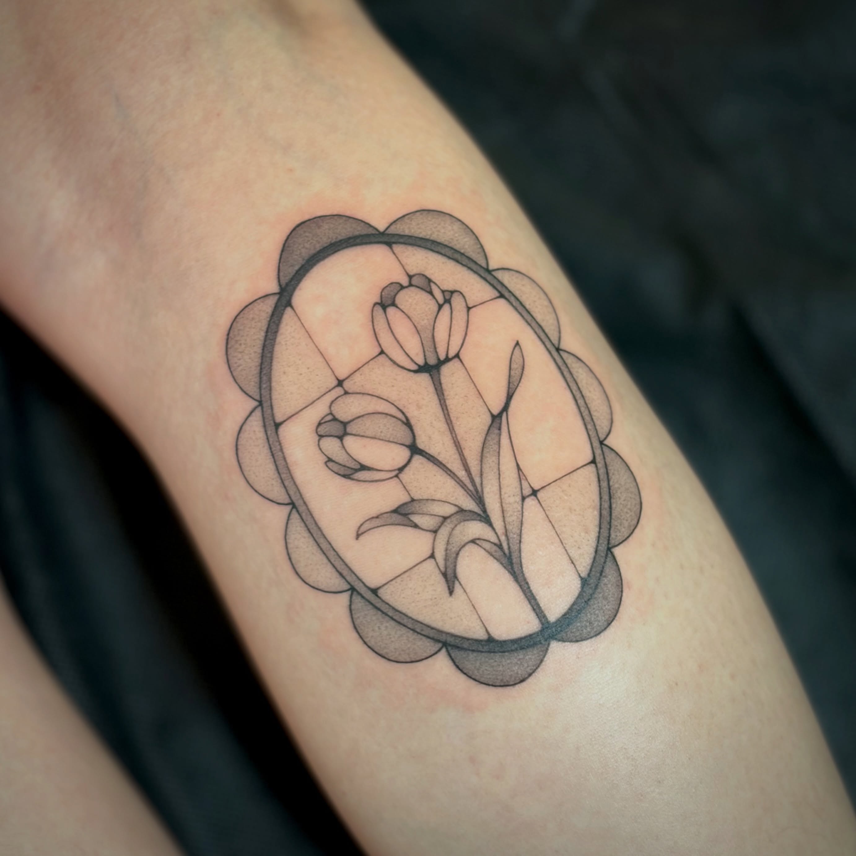Tulips geometric tattoo on the forearm by Victoria Lamorte