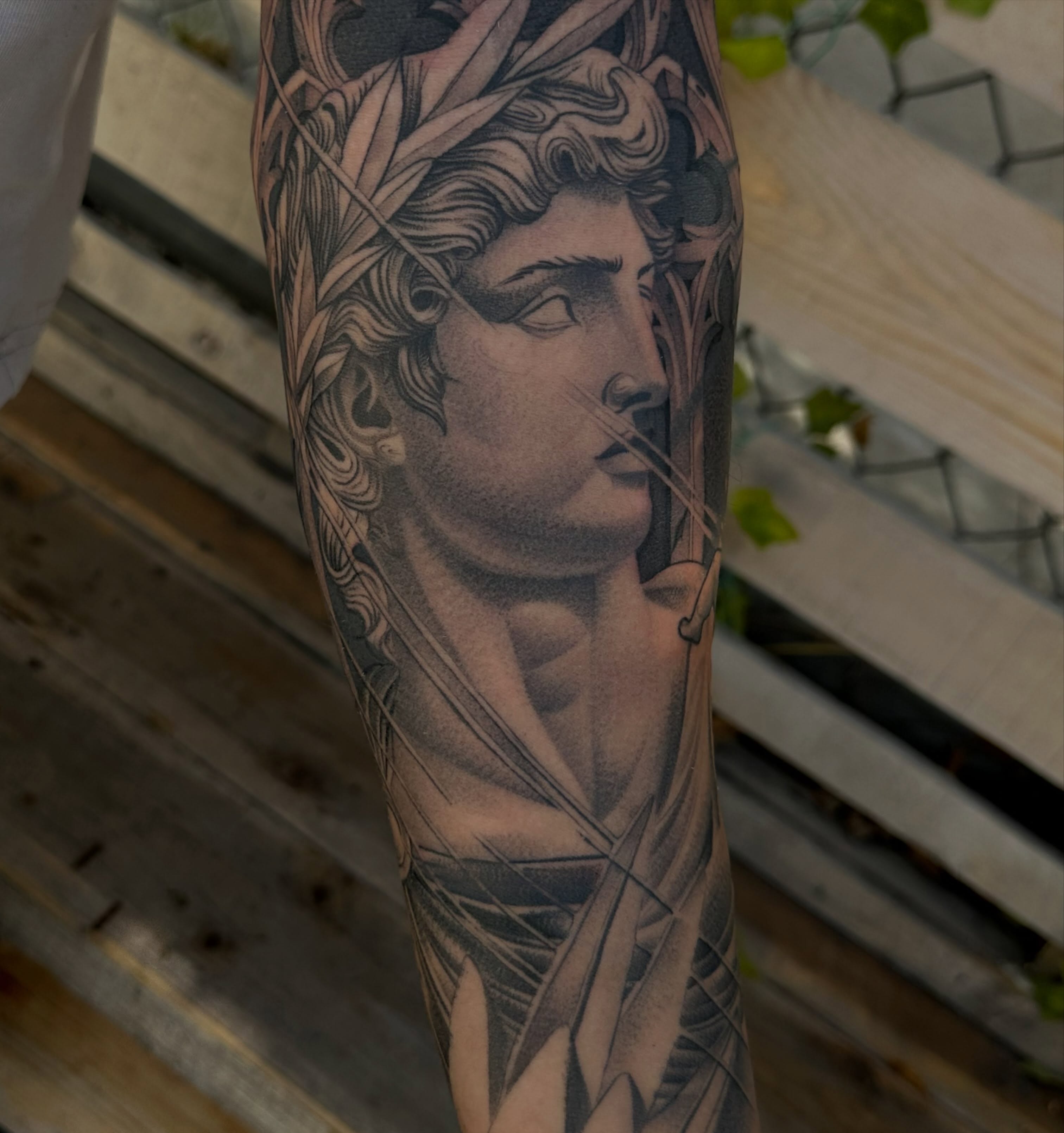 Statue head realism tattoo on the forearm by San Diego Tattoo Artist