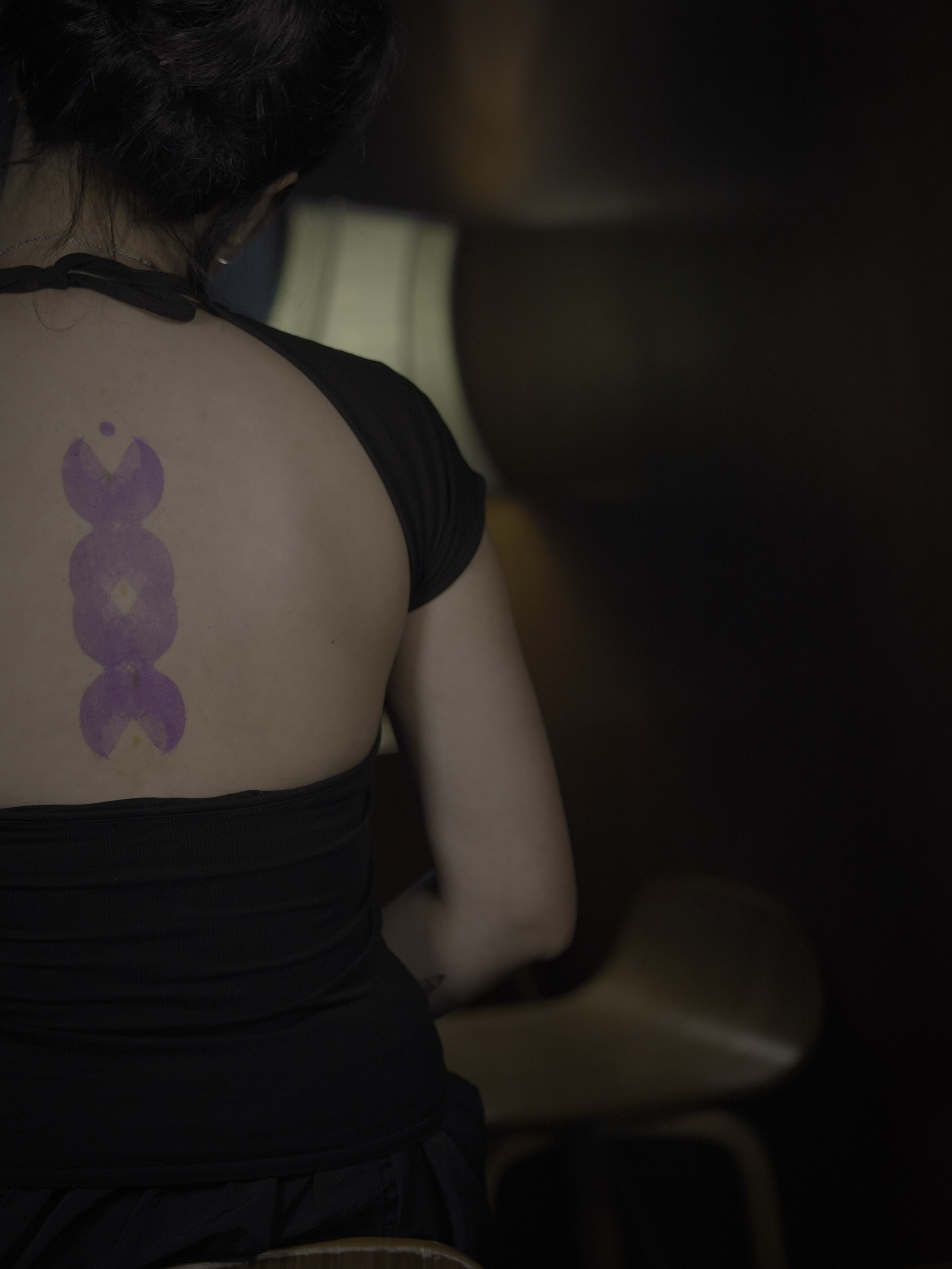 Purple abstract shape geometric tattoo on the back by Blight