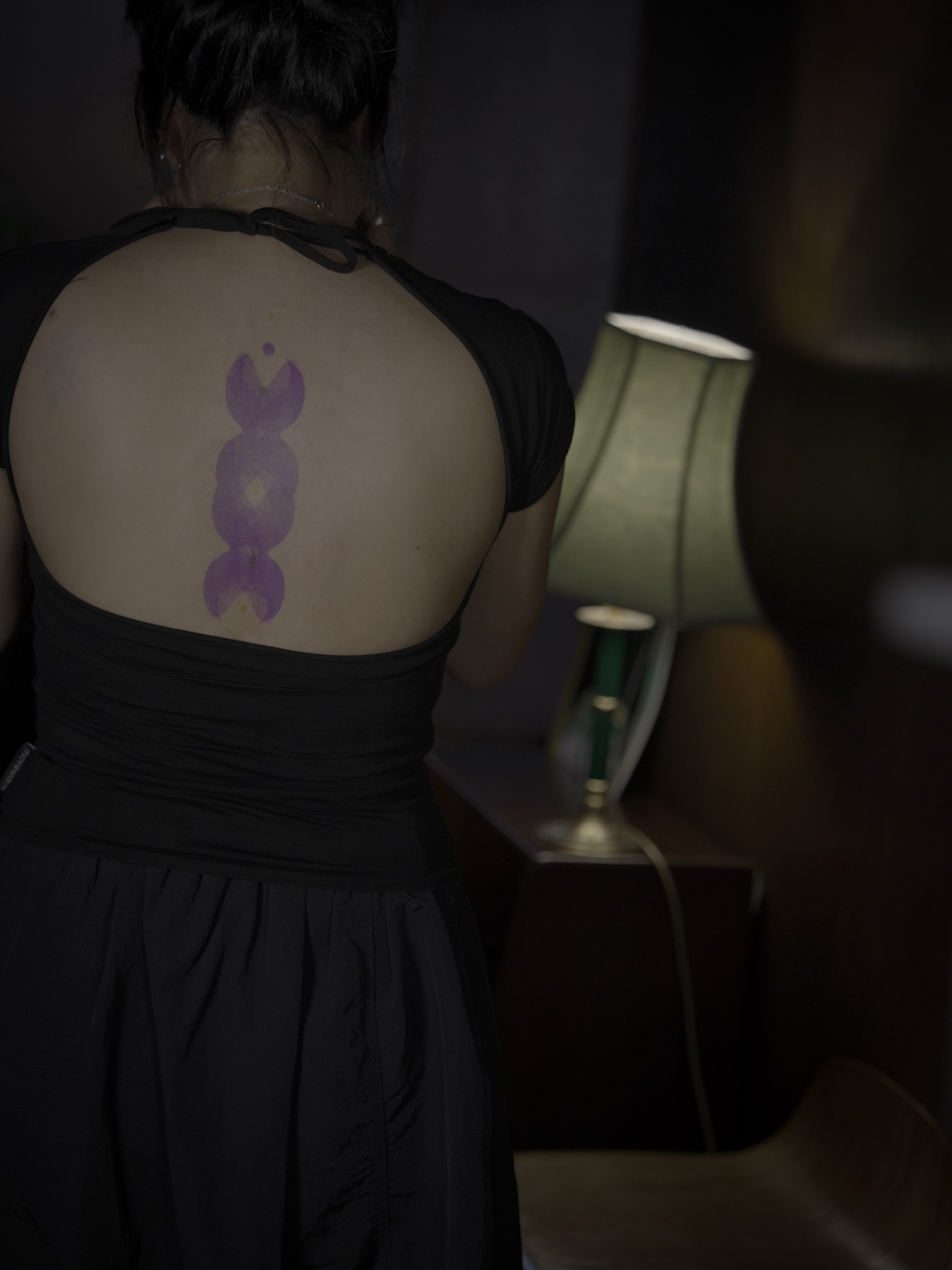 Purple abstract symbol geometric tattoo on the back by Blight