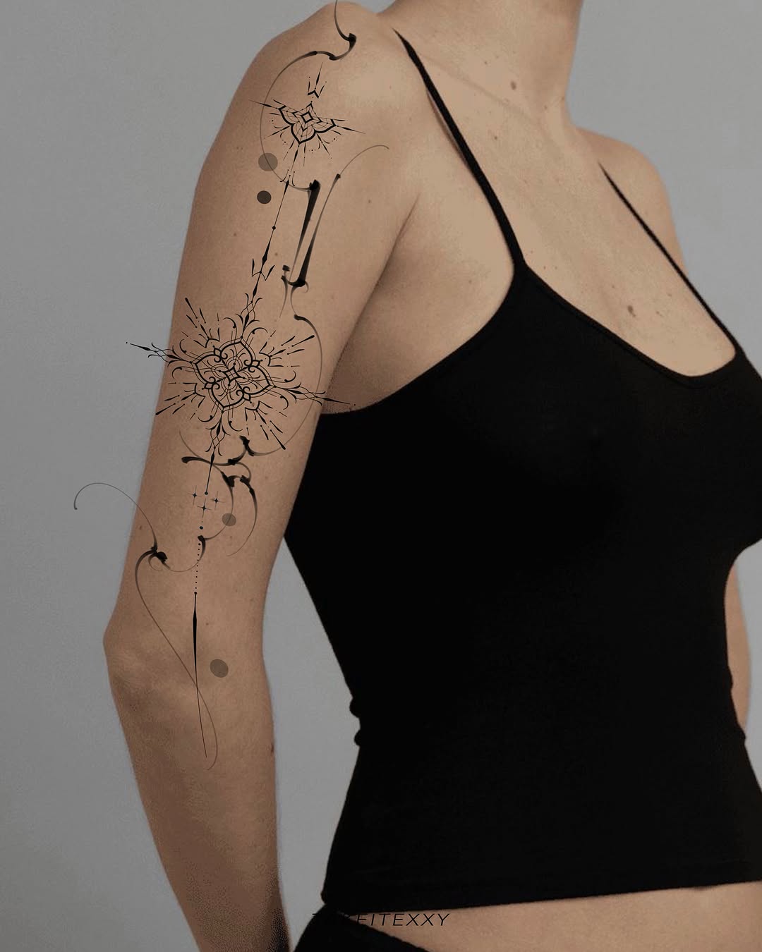 Abstract floral design dotwork tattoo on the upper arm by Easy