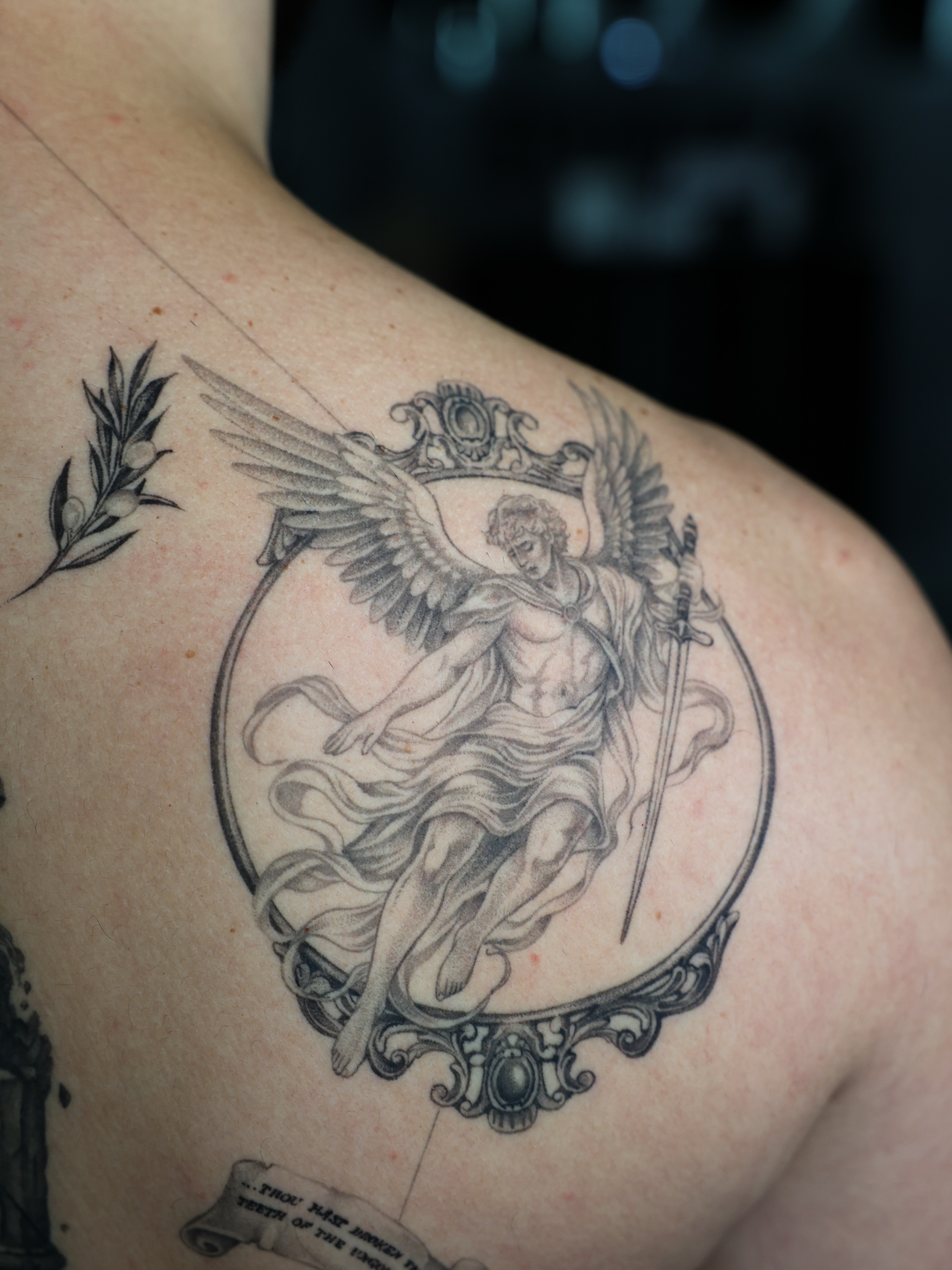 Angel with sword realism tattoo on the shoulder by Tiny