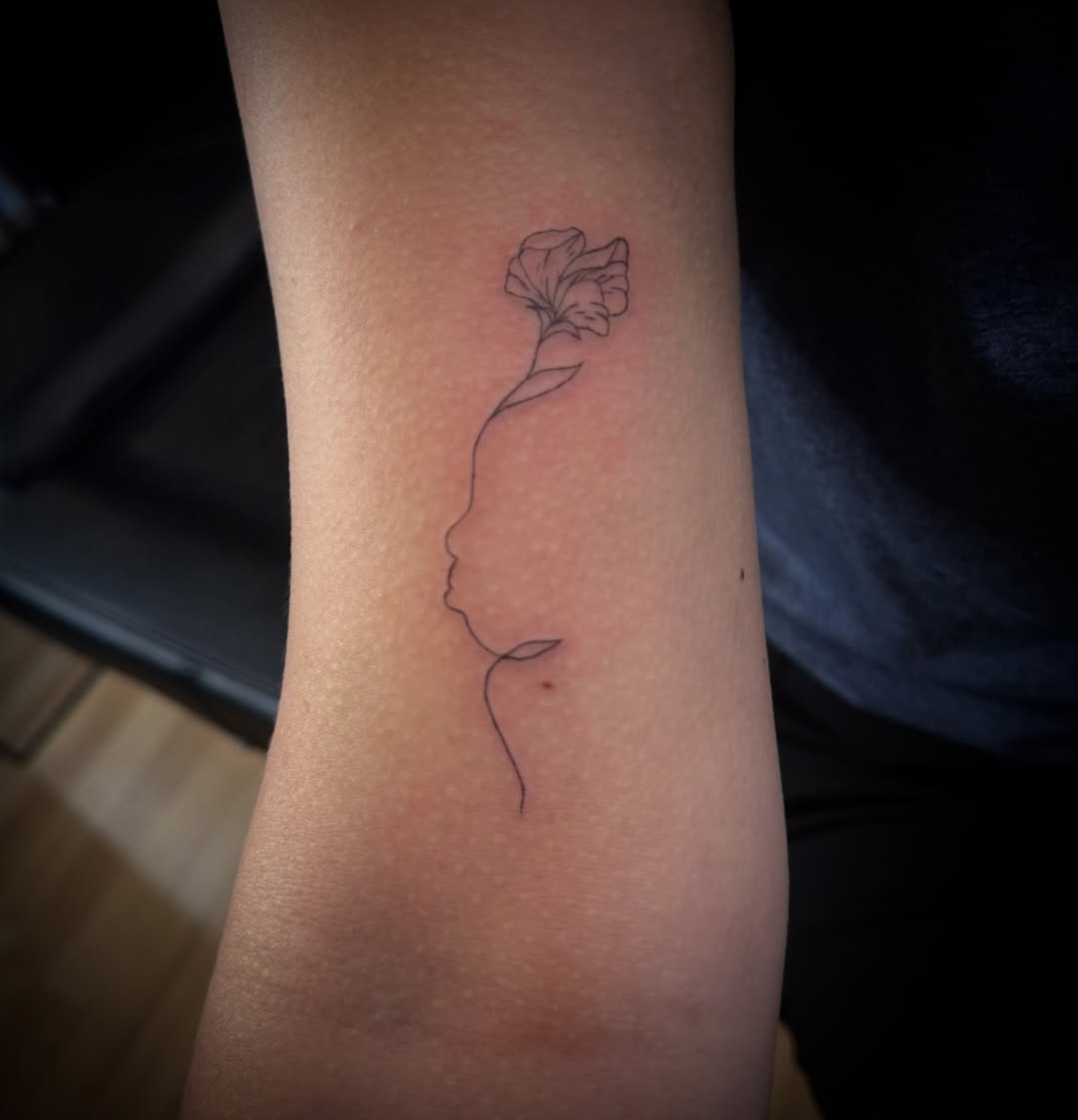 Flower fine line tattoo on the forearm by TolzinInk, Brookings, South Dakota