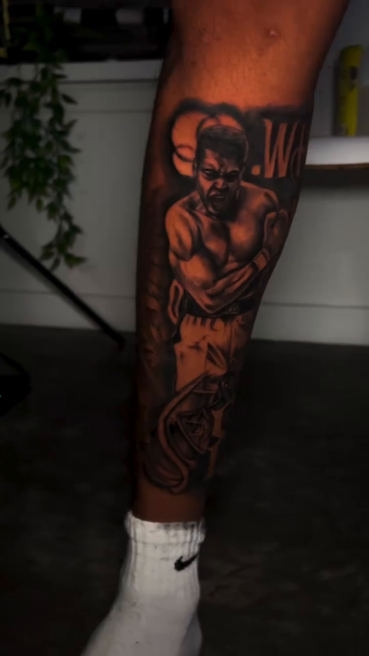 Boxer and snake realism tattoo by Lucky Lefty