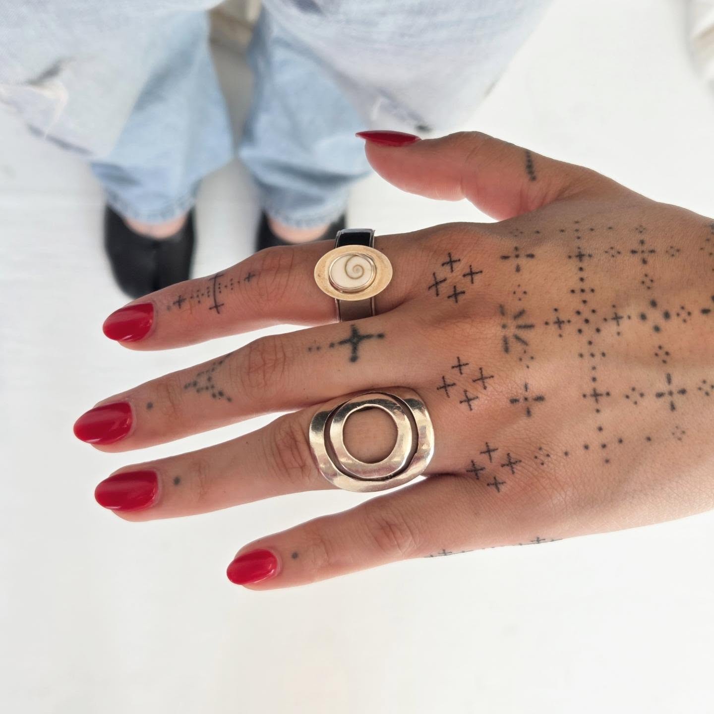 Crosses and dots dotwork tattoo on the hand by jules tattoos