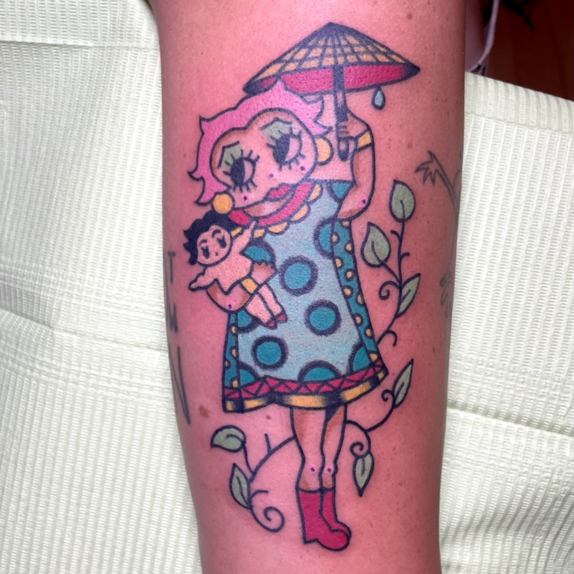 Doll and woman dotwork tattoo on the forearm by zoe ๐