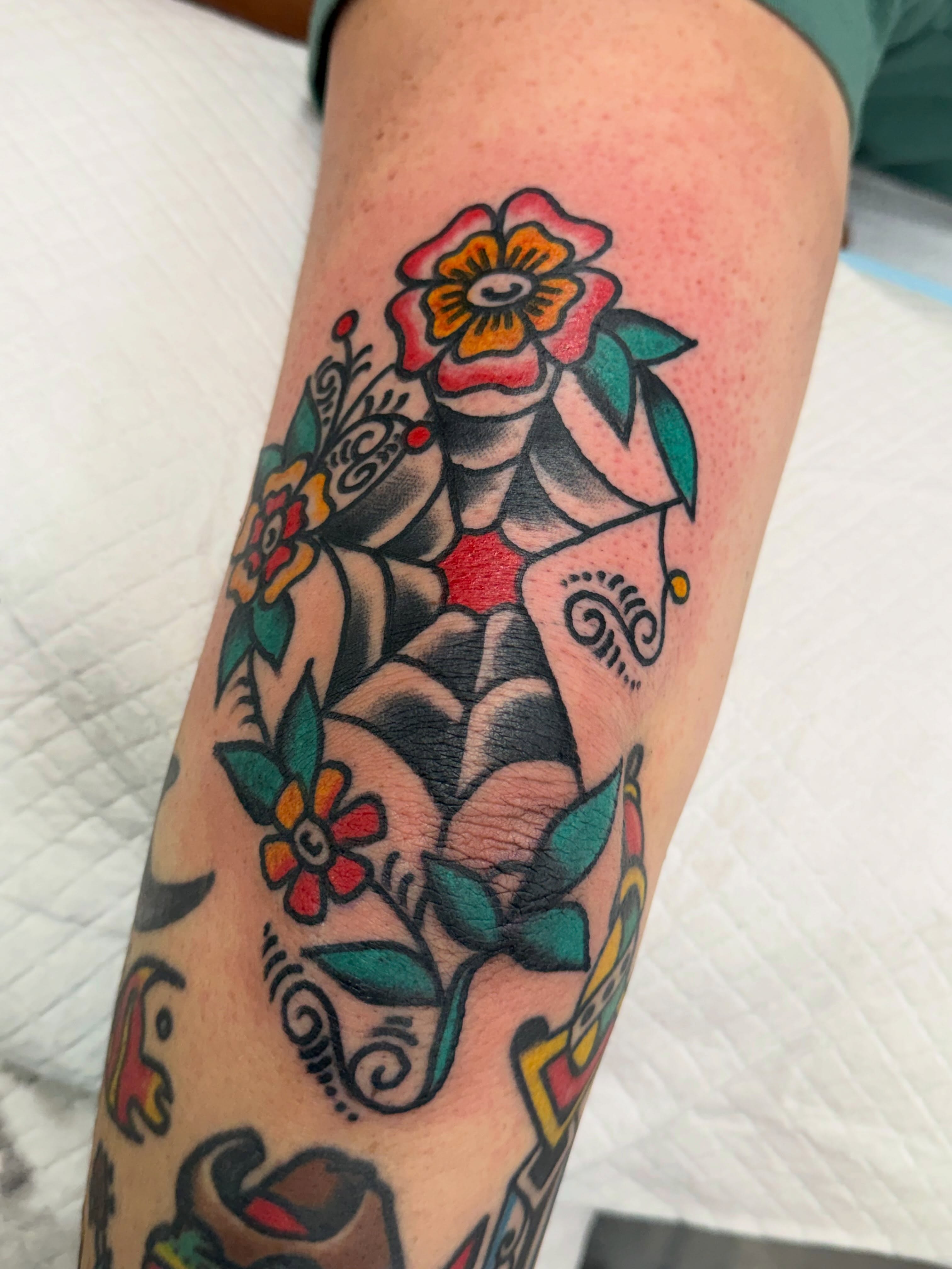Floral bouquet American traditional tattoo on the forearm by dave rash