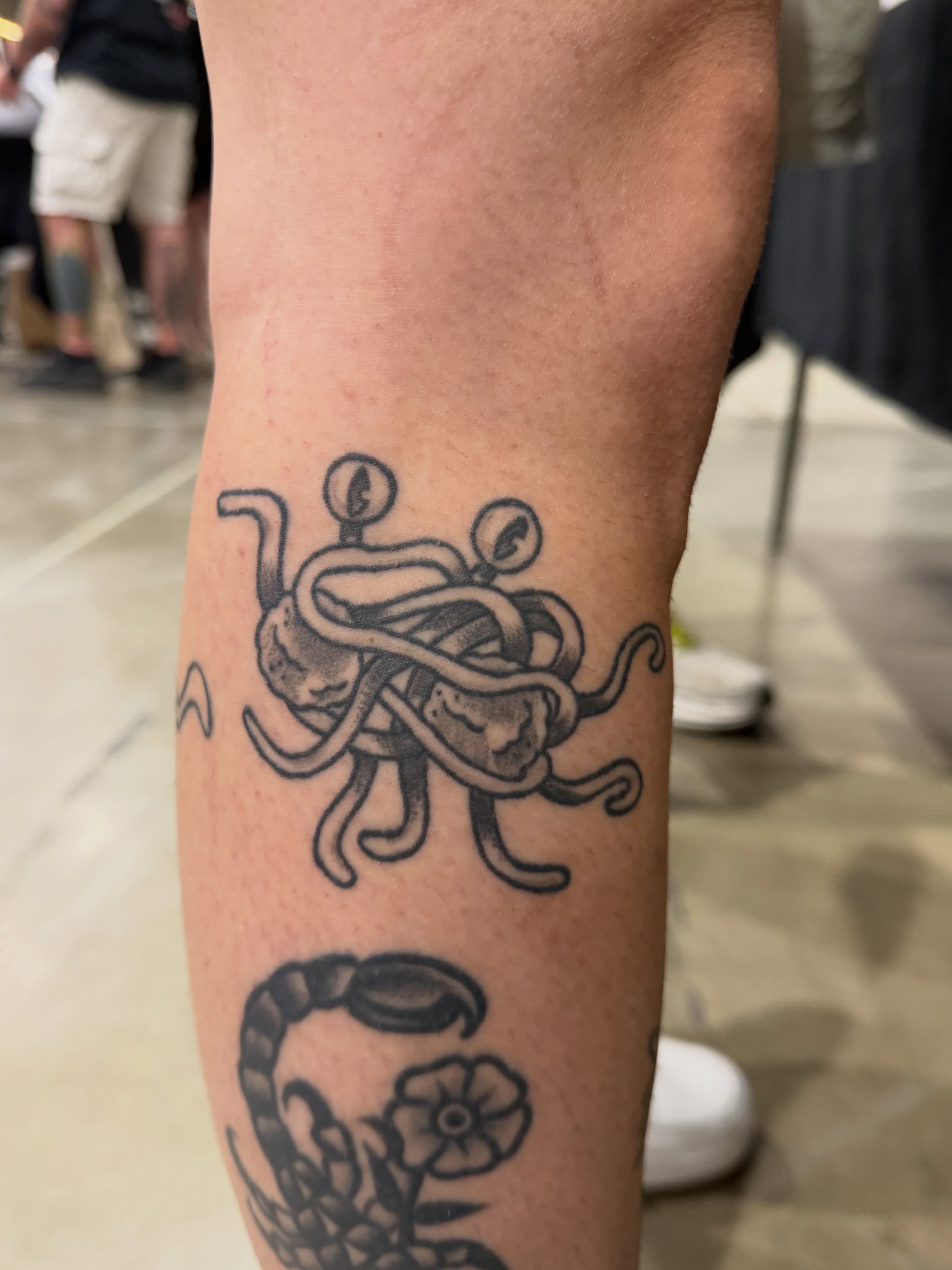 Octopus and flower dotwork tattoo on the forearm by julian solis, Houston, Texas
