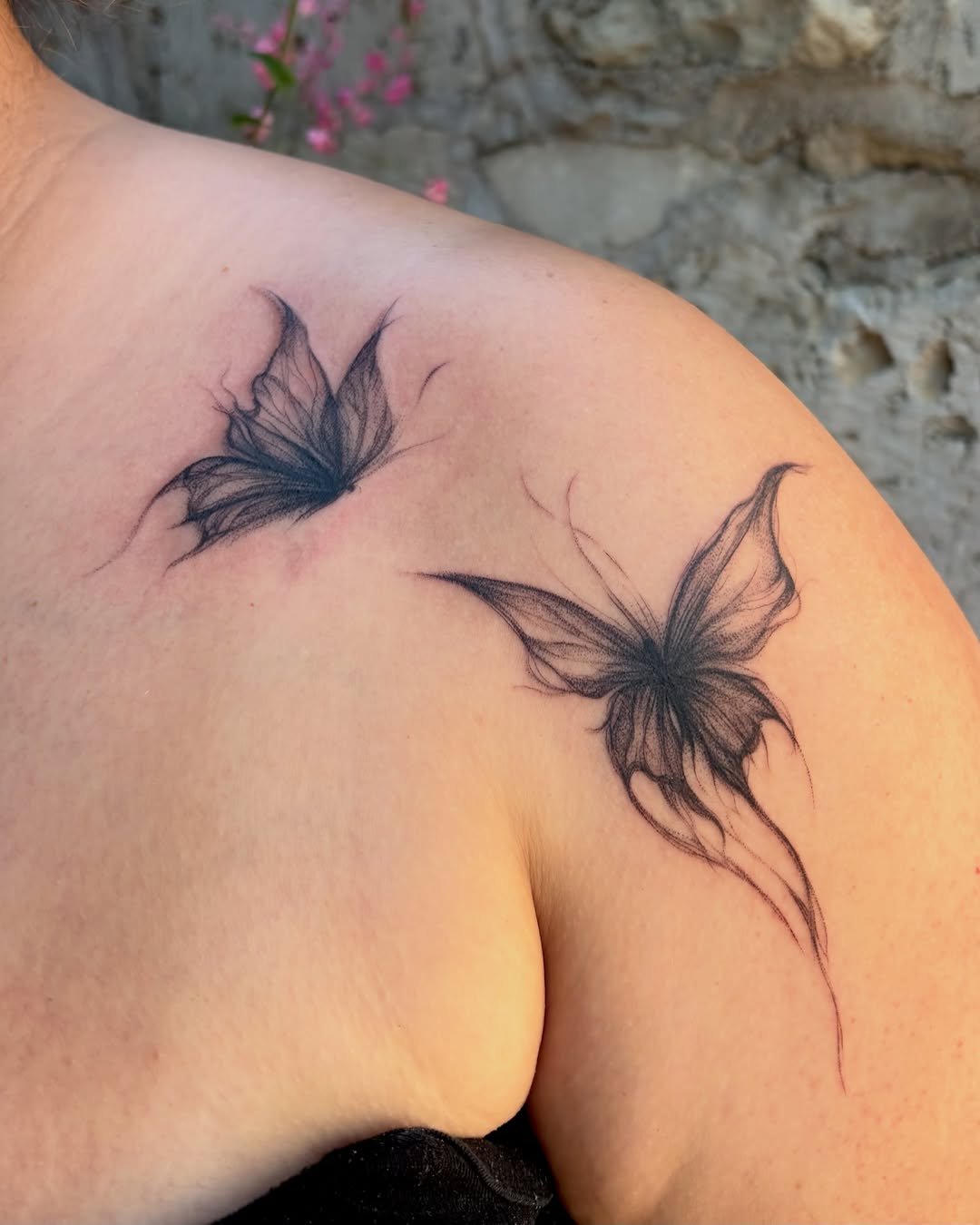 Butterflies black and grey tattoo on the shoulder by Kylah Amin Tattoo