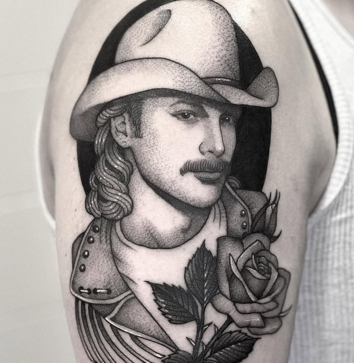Portrait with rose dotwork tattoo on the forearm by Luna Lucero