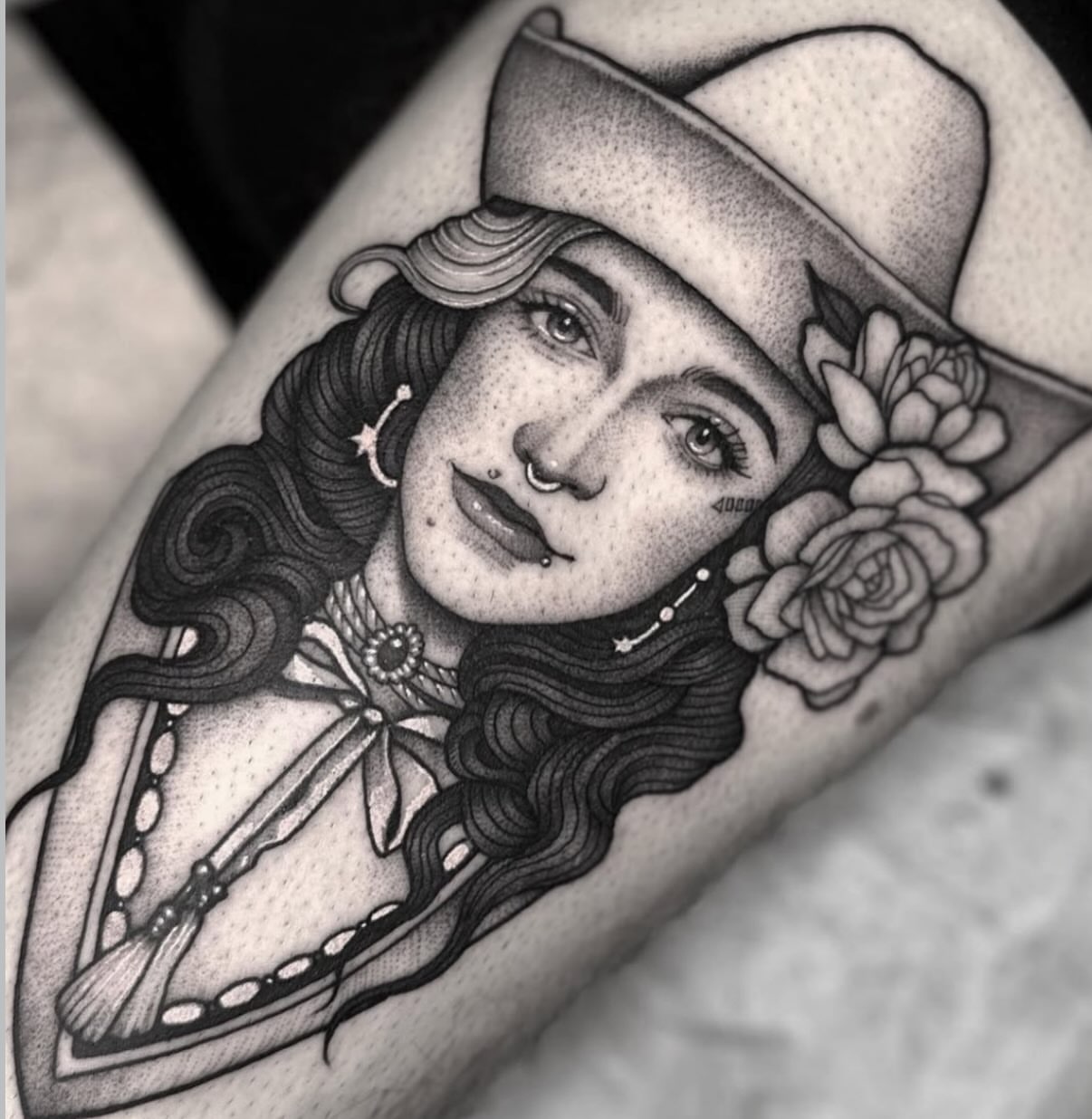 Woman with hat and flowers dotwork tattoo on the forearm by Luna Lucero