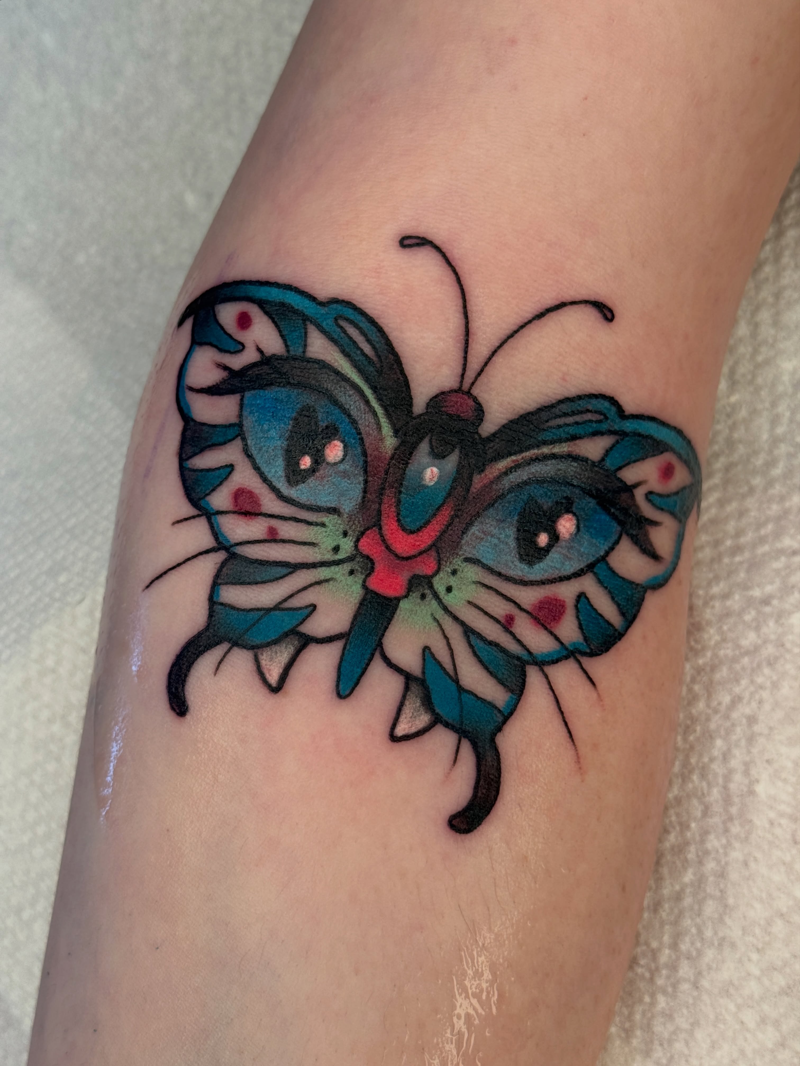Butterfly American traditional tattoo on the forearm by Tattoos by Angel Lee