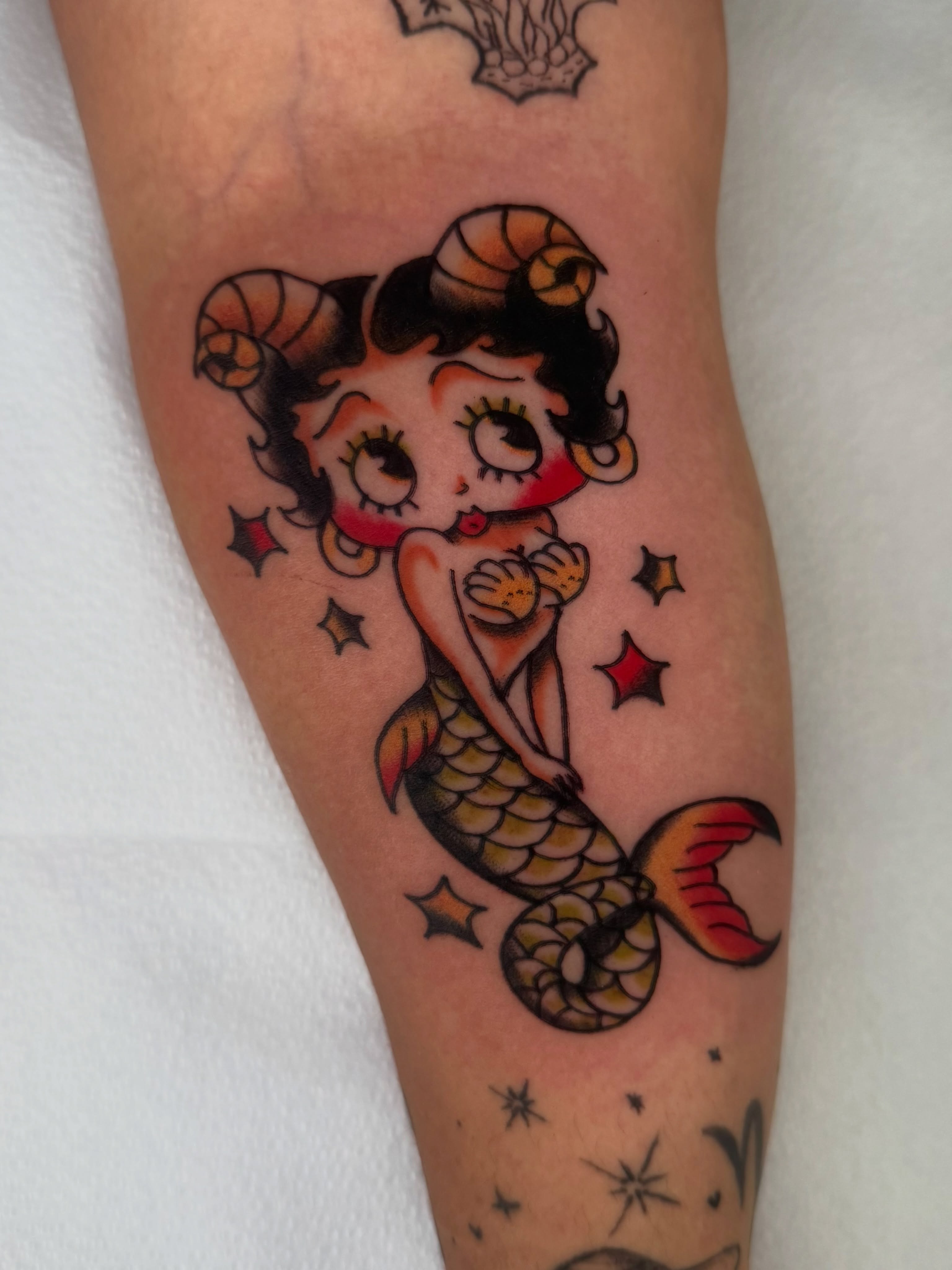 Mermaid American traditional tattoo on the forearm by Lexie Graff