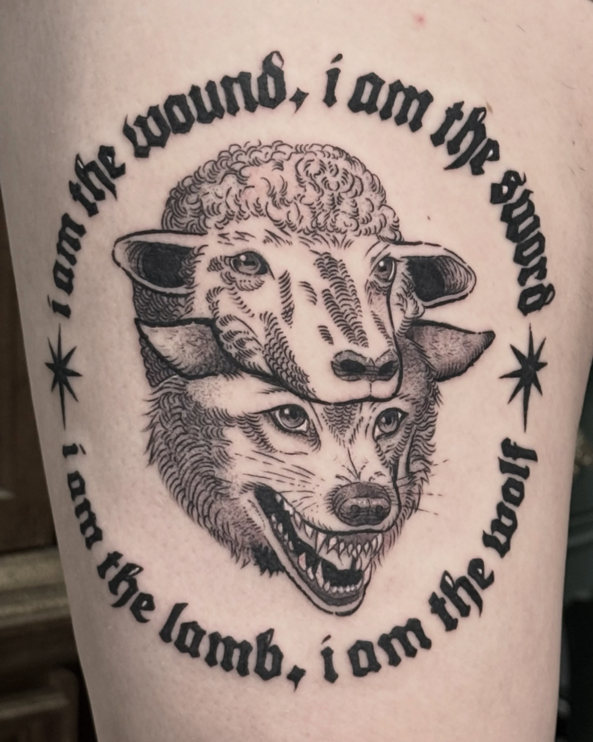 Wolf and sheep realism tattoo on the forearm by Christian