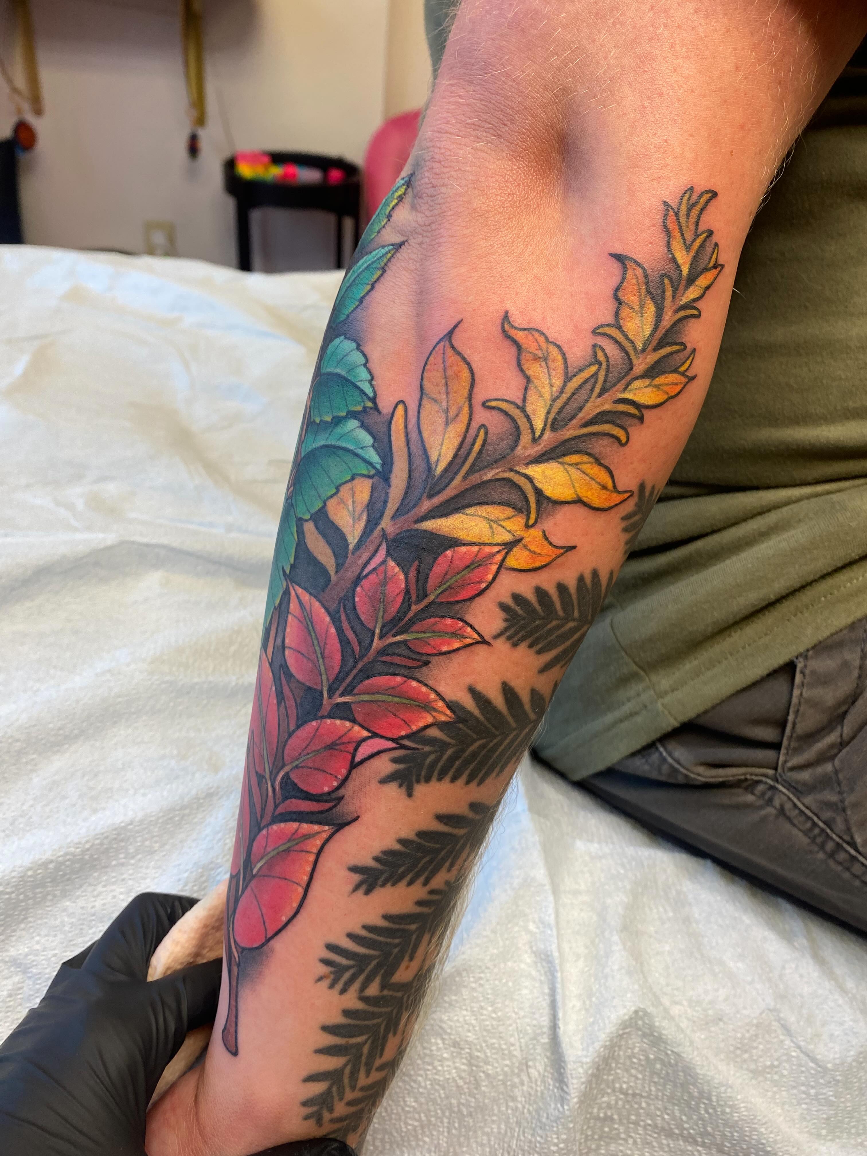 Branch with leaves new school tattoo on the forearm by Kellsey Mull