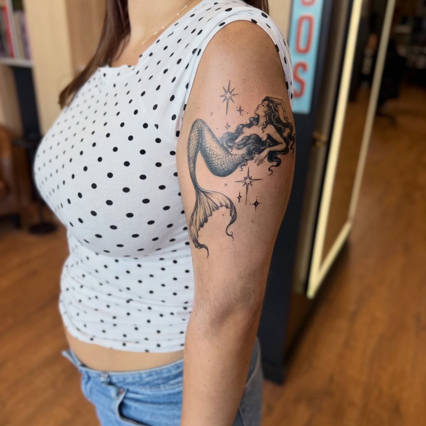 Mermaid black and grey tattoo on the upper arm by Chuckthegirl