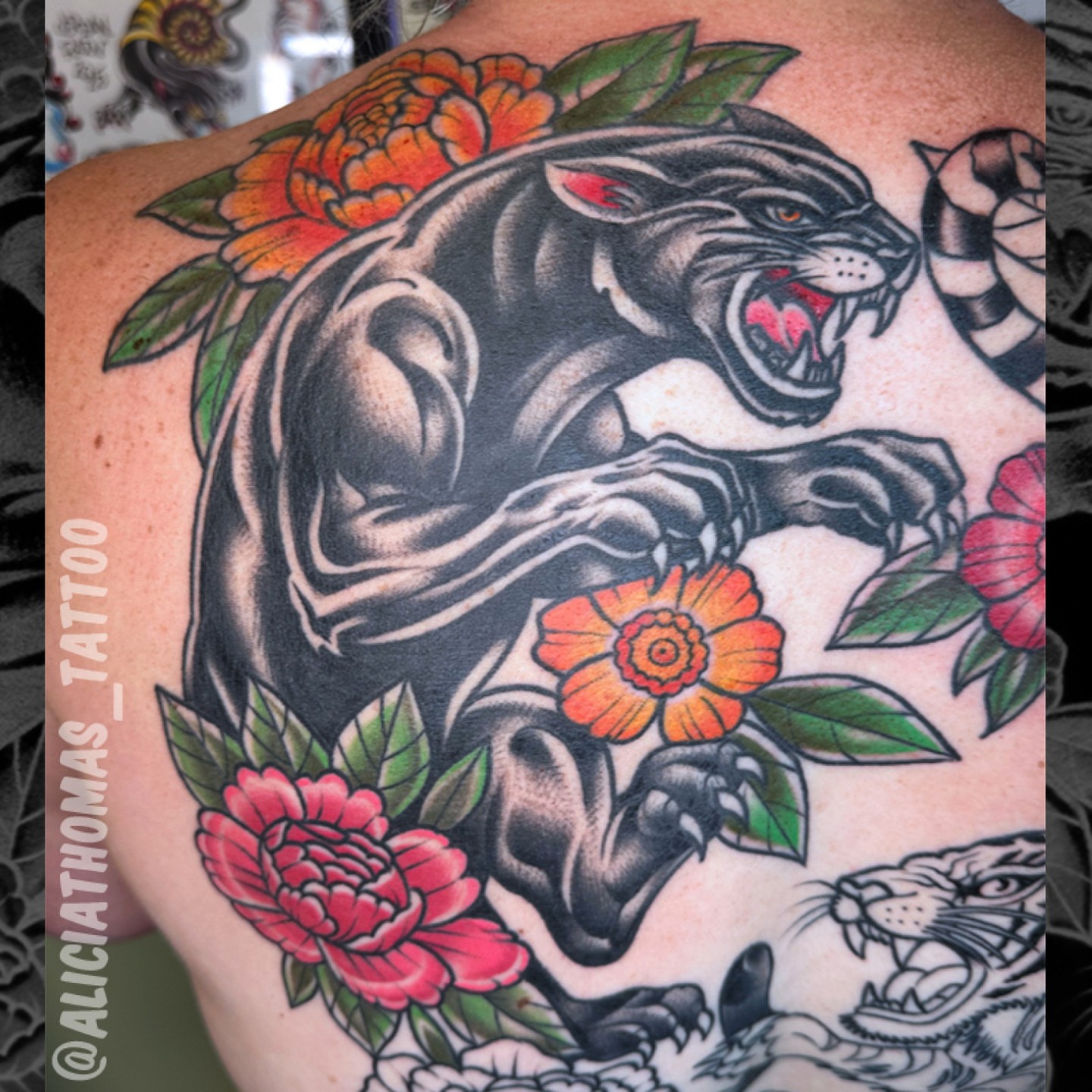 Panther and flowers American traditional tattoo on the back by 𝖆𝖑𝖎𝖈𝖎𝖆 𝖙𝖍𝖔𝖒𝖆𝖘