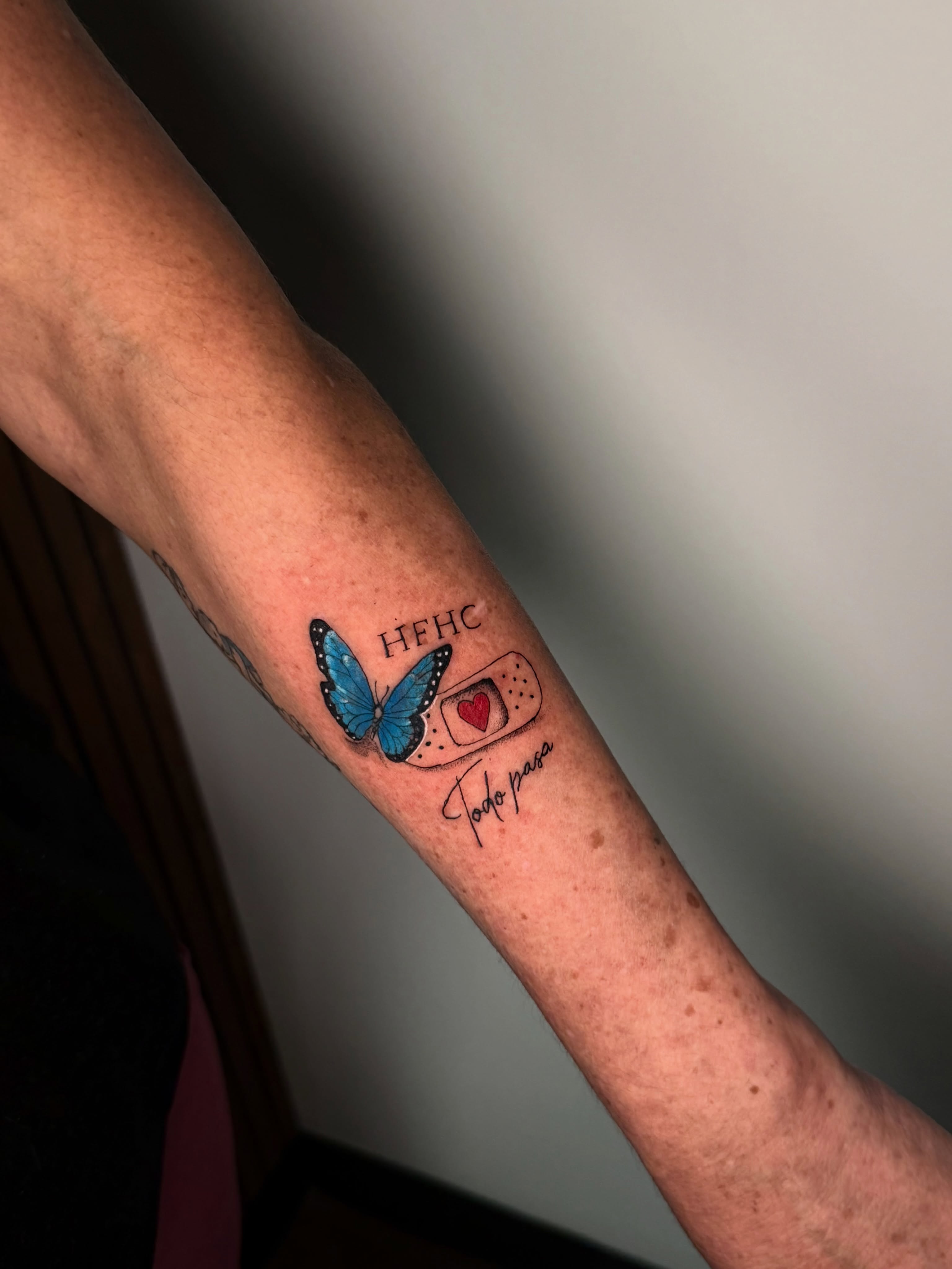 Butterfly and bandaid dotwork tattoo on the forearm by Sebastian martinez, Memphis, Tennessee