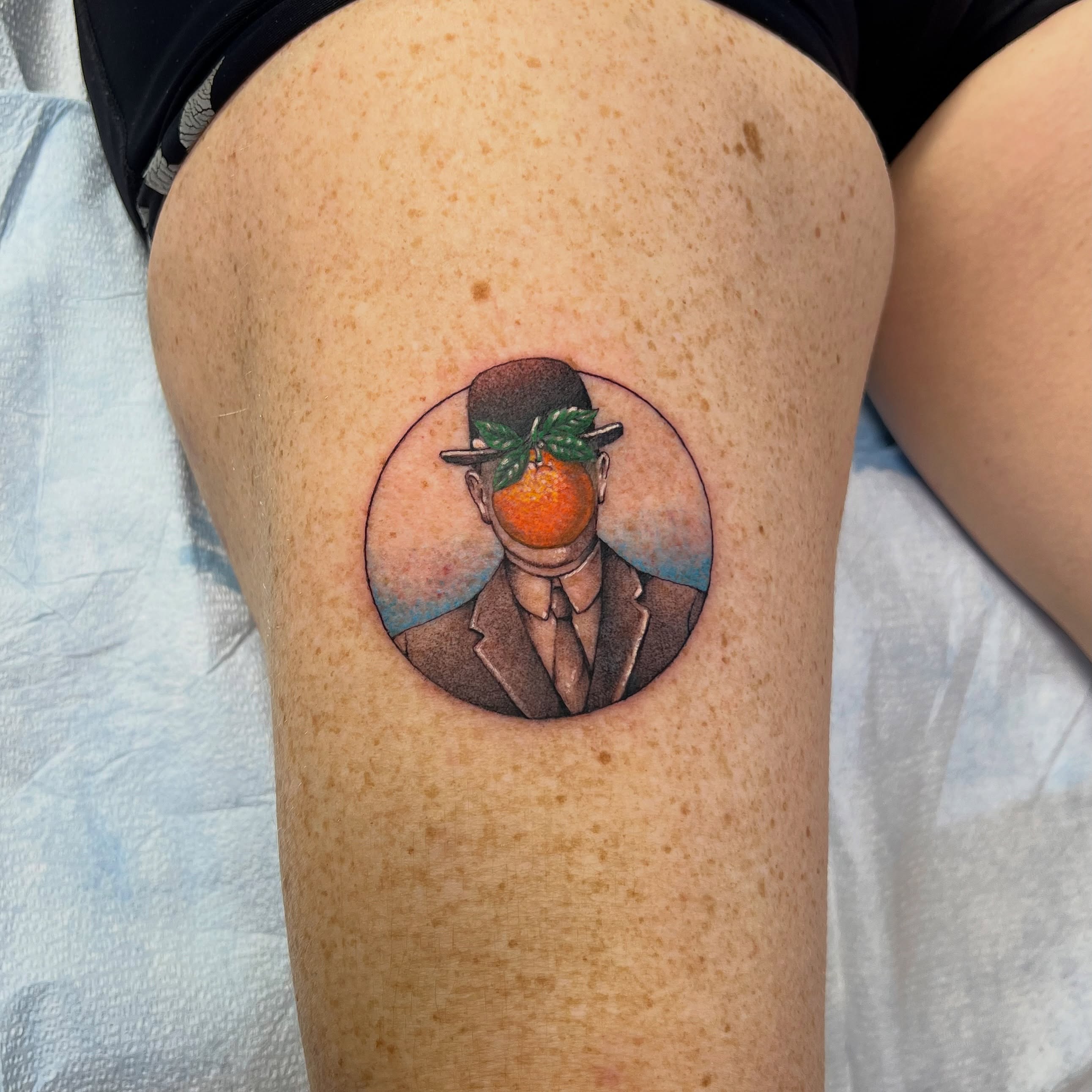 Man with orange head realism tattoo on the thigh by ⚒dptattoos ⚒, East Williamsburg, Brooklyn