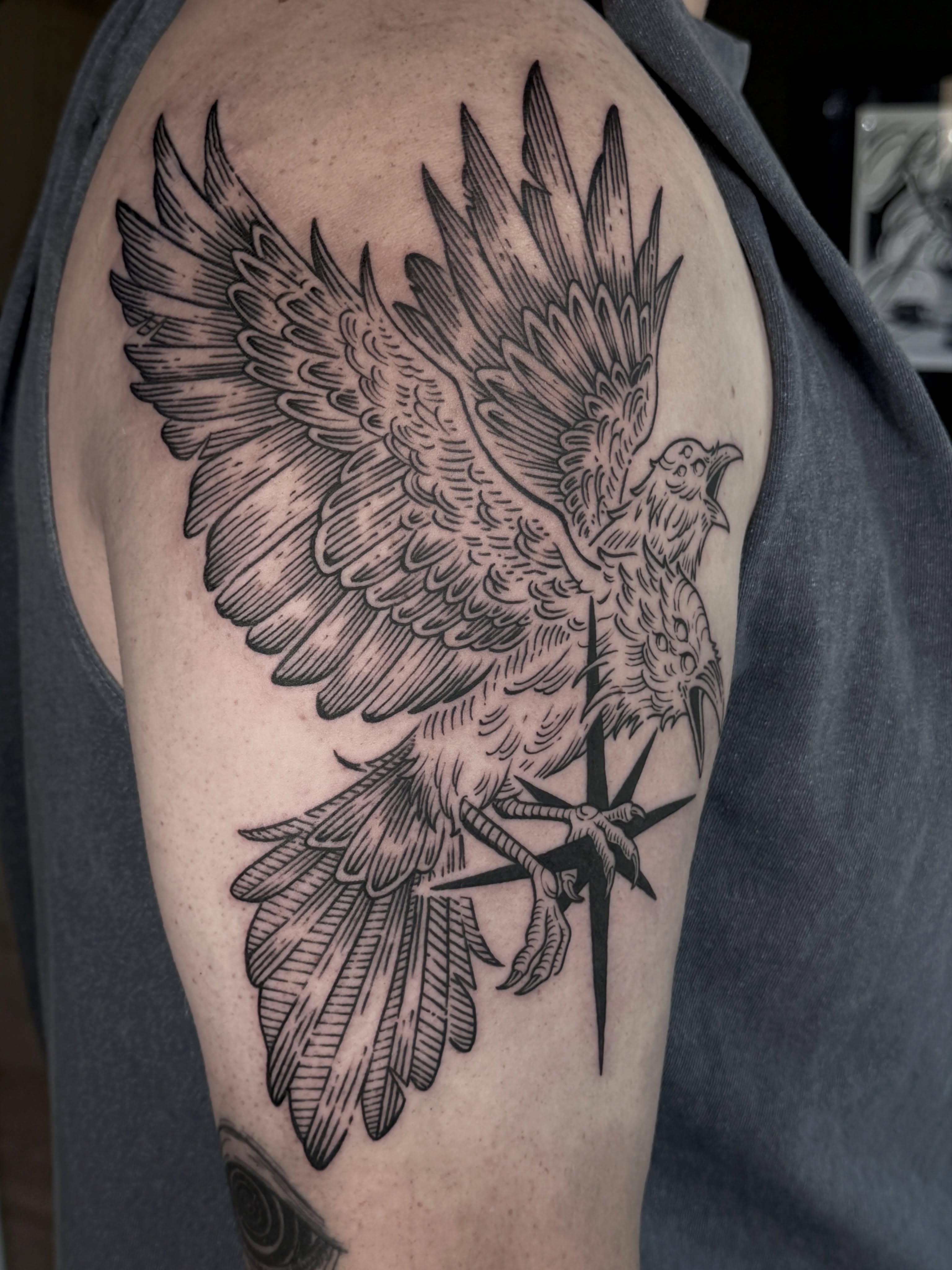 Bird black and grey tattoo on the shoulder by Hannah May, La Mesa, California