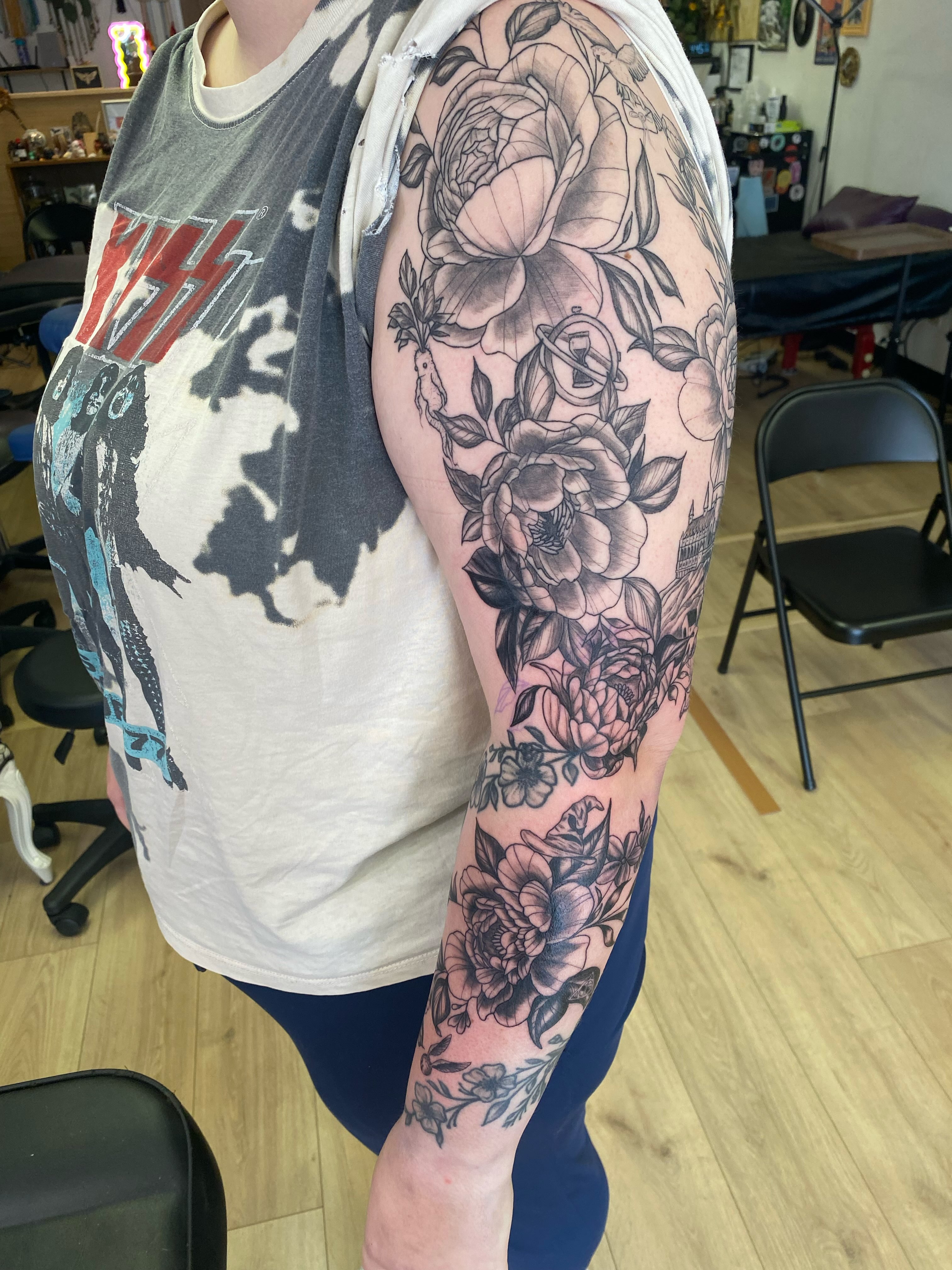 Floral bouquet black and grey tattoo on the forearm by Katie Leeper