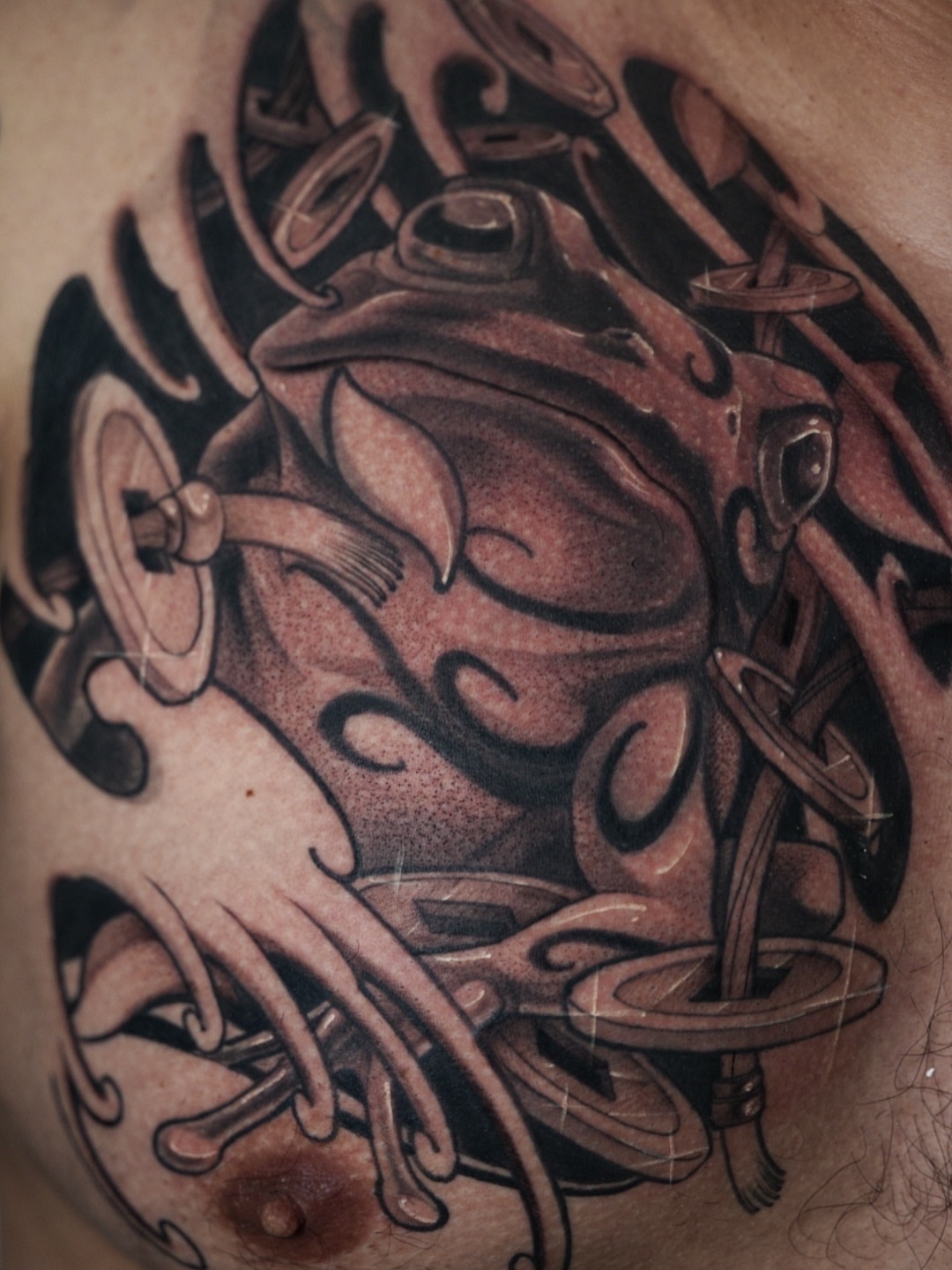 Frog geometric tattoo on the chest by Manuel Alejandro Maldonado