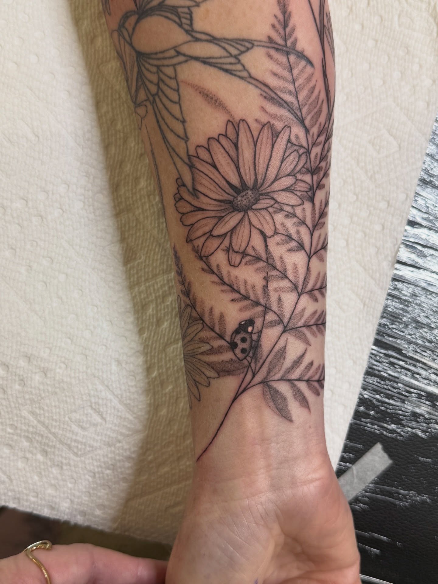 Flower and leaves black and grey tattoo on the forearm by WhoisLaineyTattoos