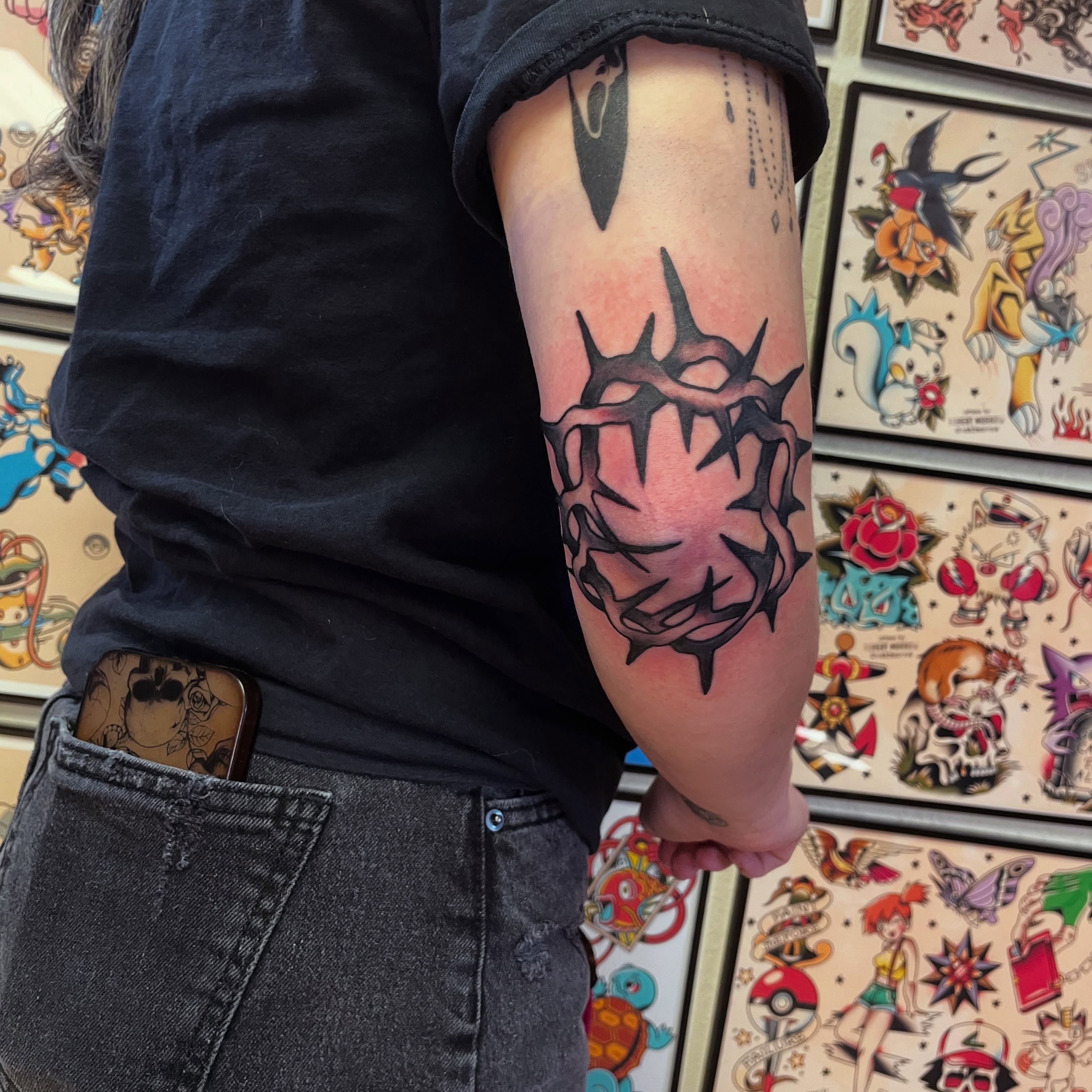 Crown of thorns American traditional tattoo on the forearm by Robert Morrow