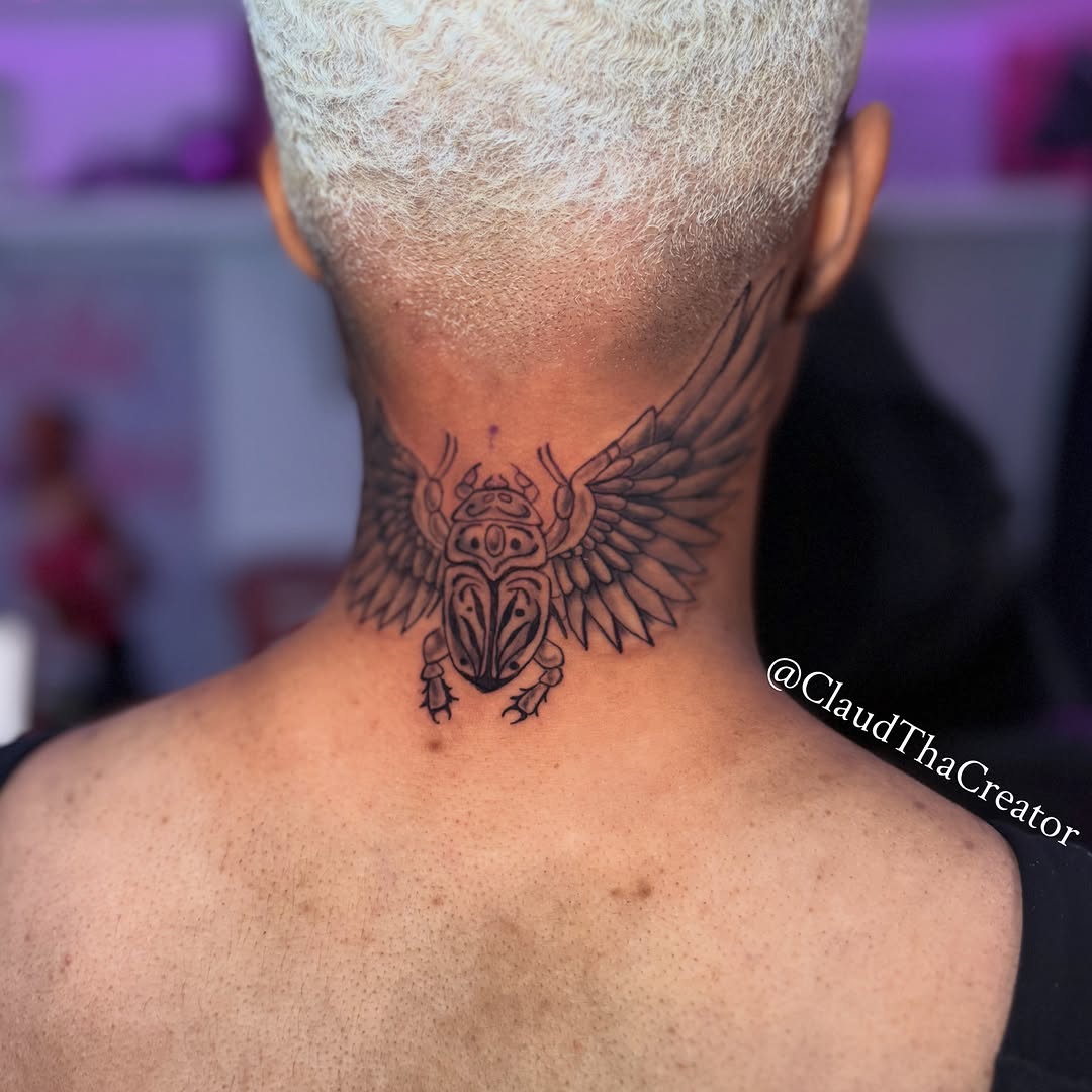 Scarab beetle black and grey tattoo on the neck by claud, Atlanta, Georgia