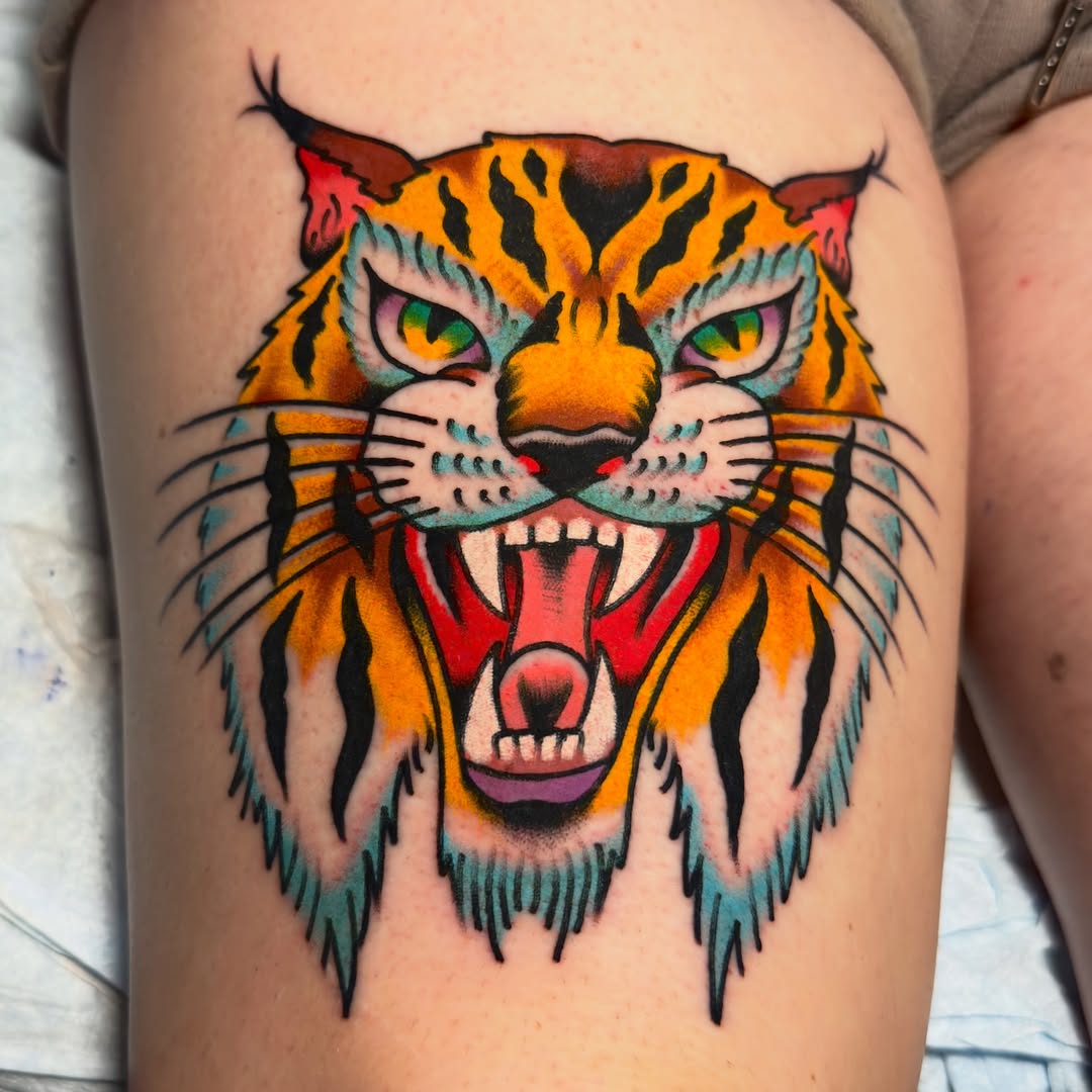 Tiger American traditional tattoo on the thigh by 𝐬𝐚𝐬𝐡𝐚 𝐯𝐚𝐧𝐝𝐚𝐥, Nashville, Tennessee