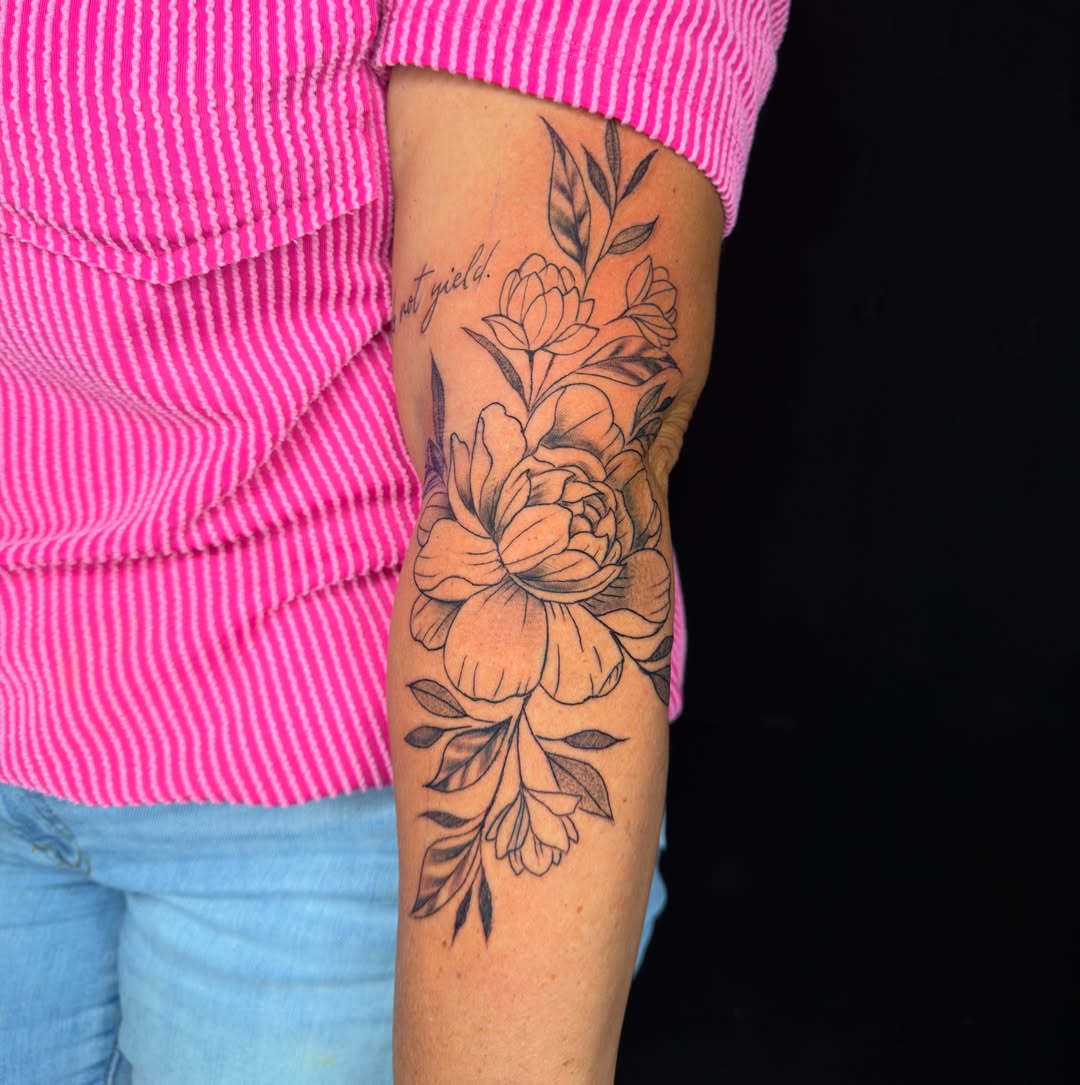 Floral bouquet black and grey tattoo on the forearm by David Yancy III