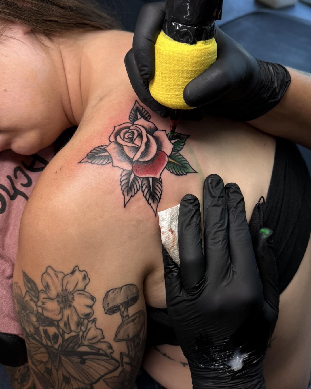 Rose American traditional tattoo on the shoulder by Bryon Smith