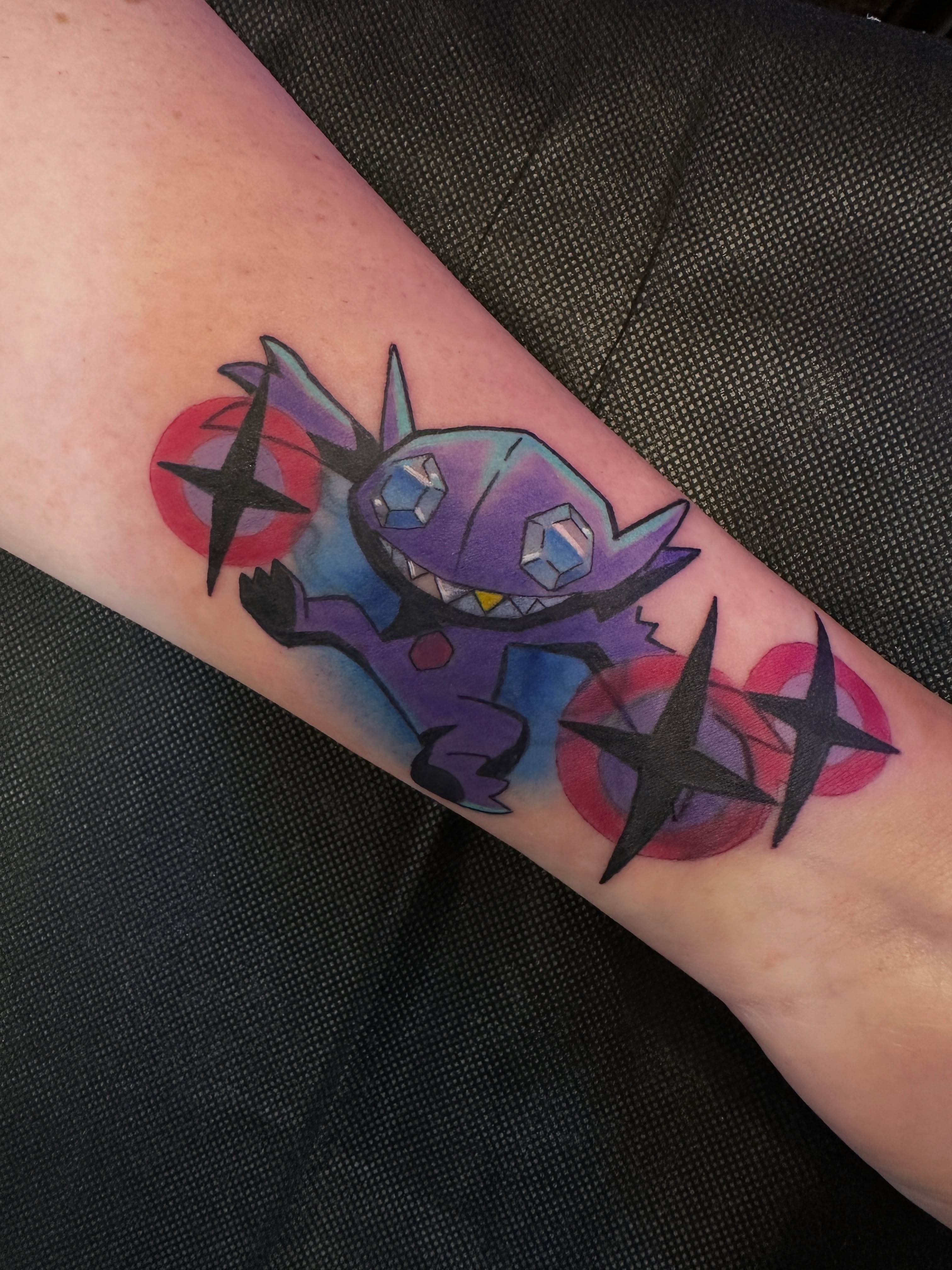 Monster geometric tattoo on the forearm by Dustin Hughes