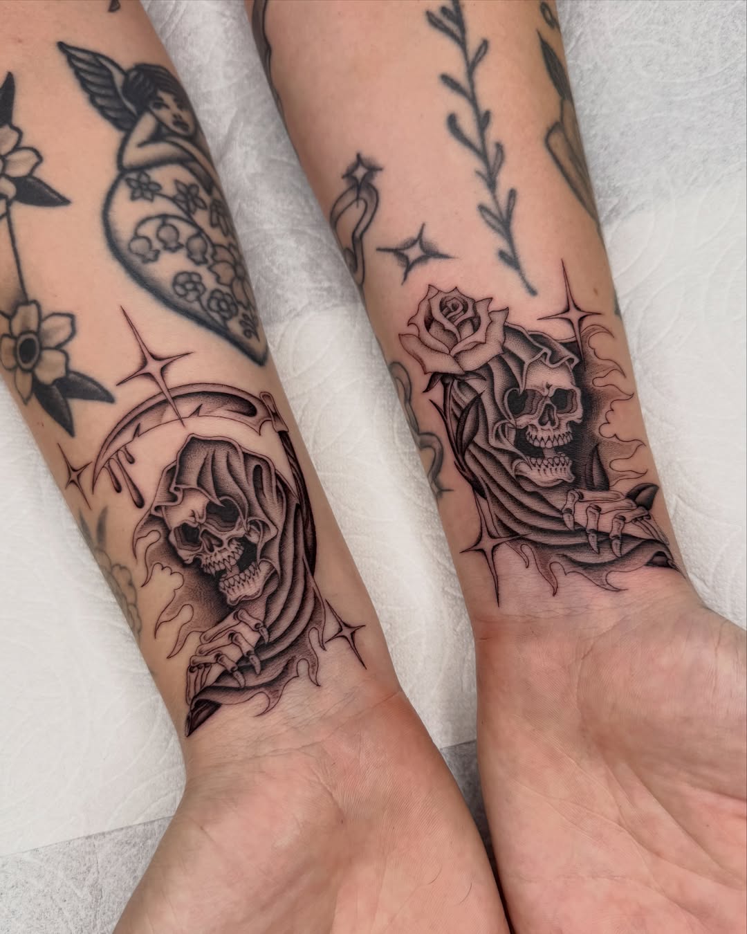 Reaper and roses realism tattoo on the forearm by IVY