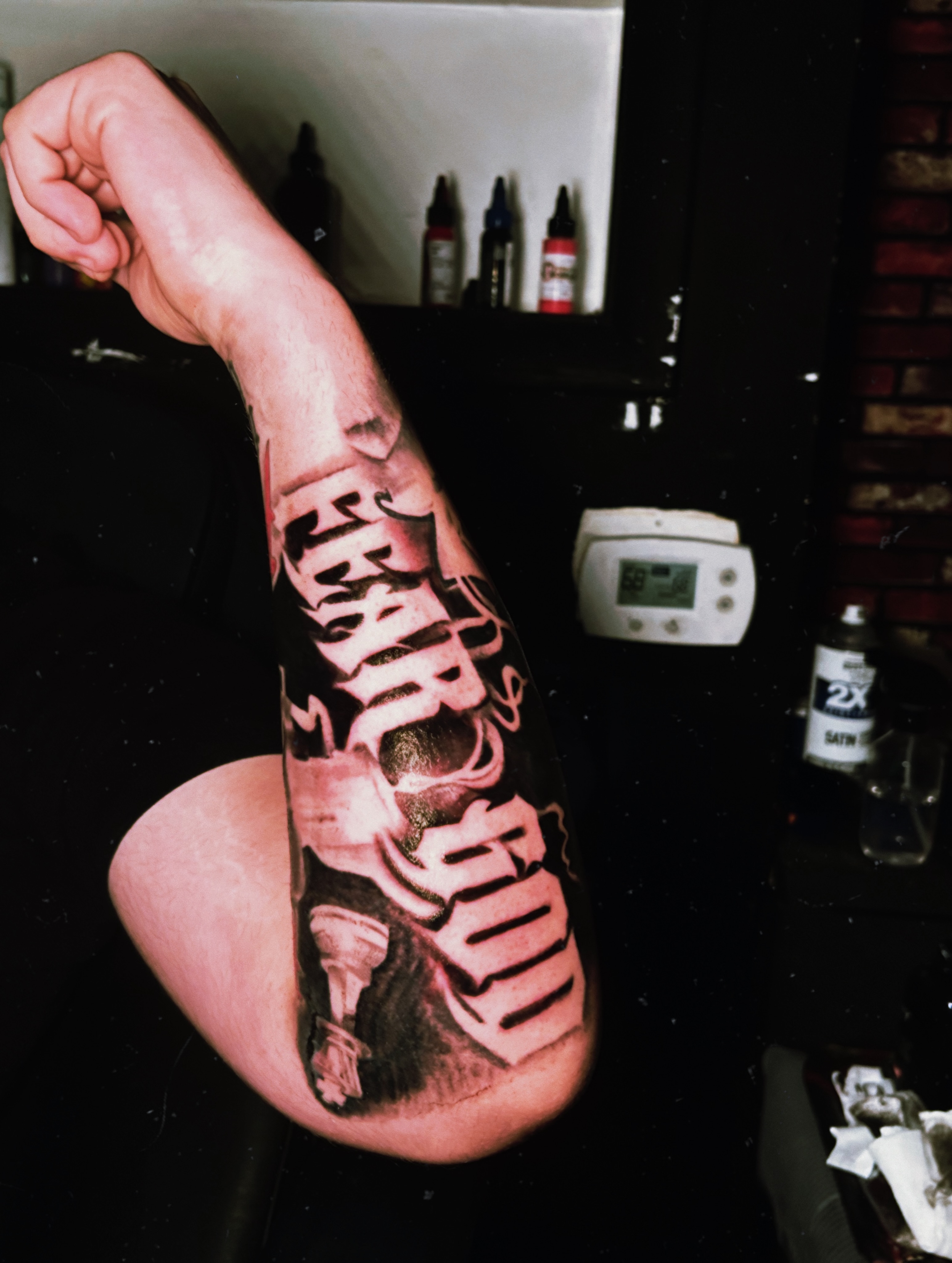 Lettering black and grey tattoo on the forearm by Tito Cross ❤️‍🔥