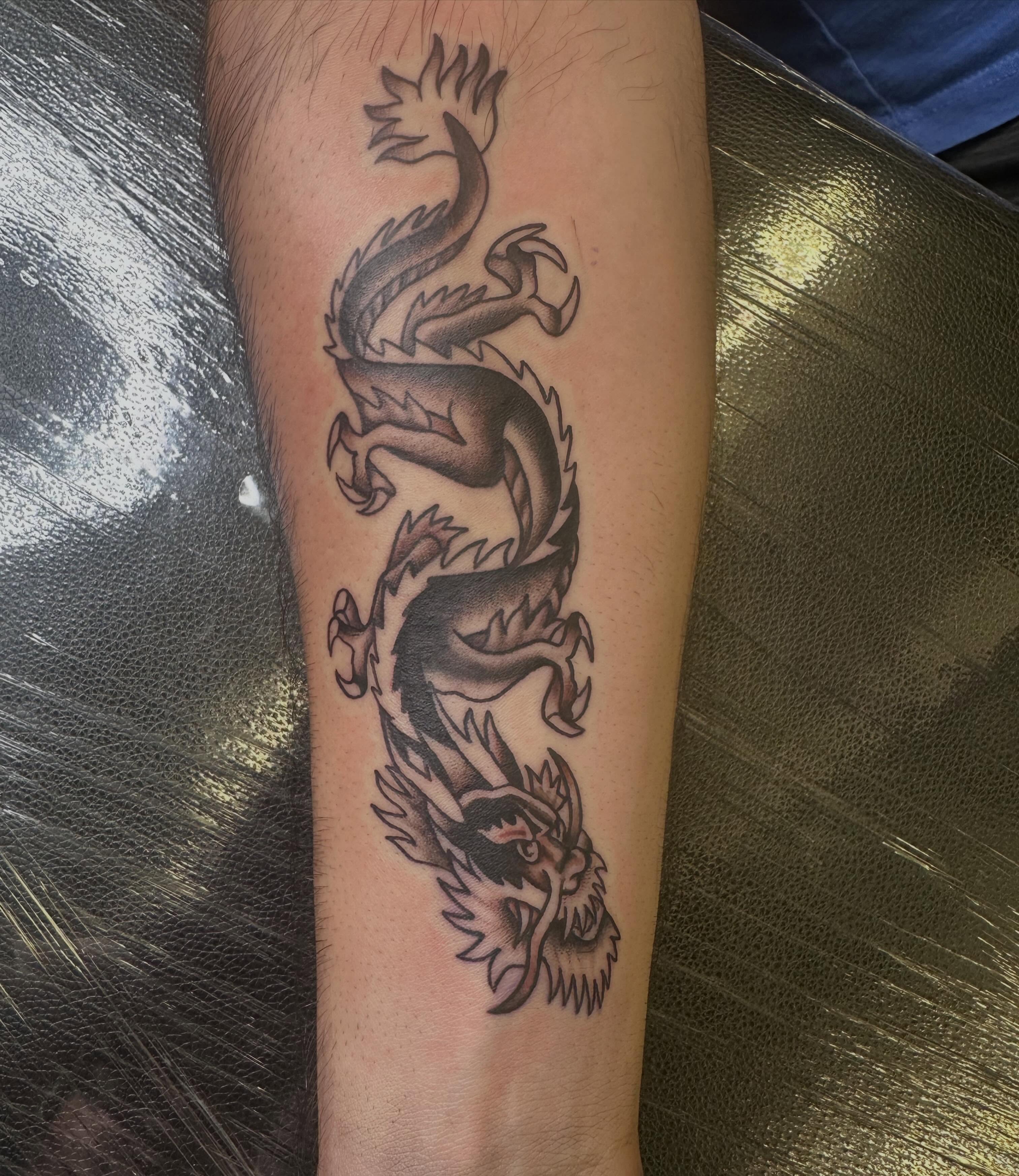Dragon black and grey tattoo on the forearm by Ink by Hailey π