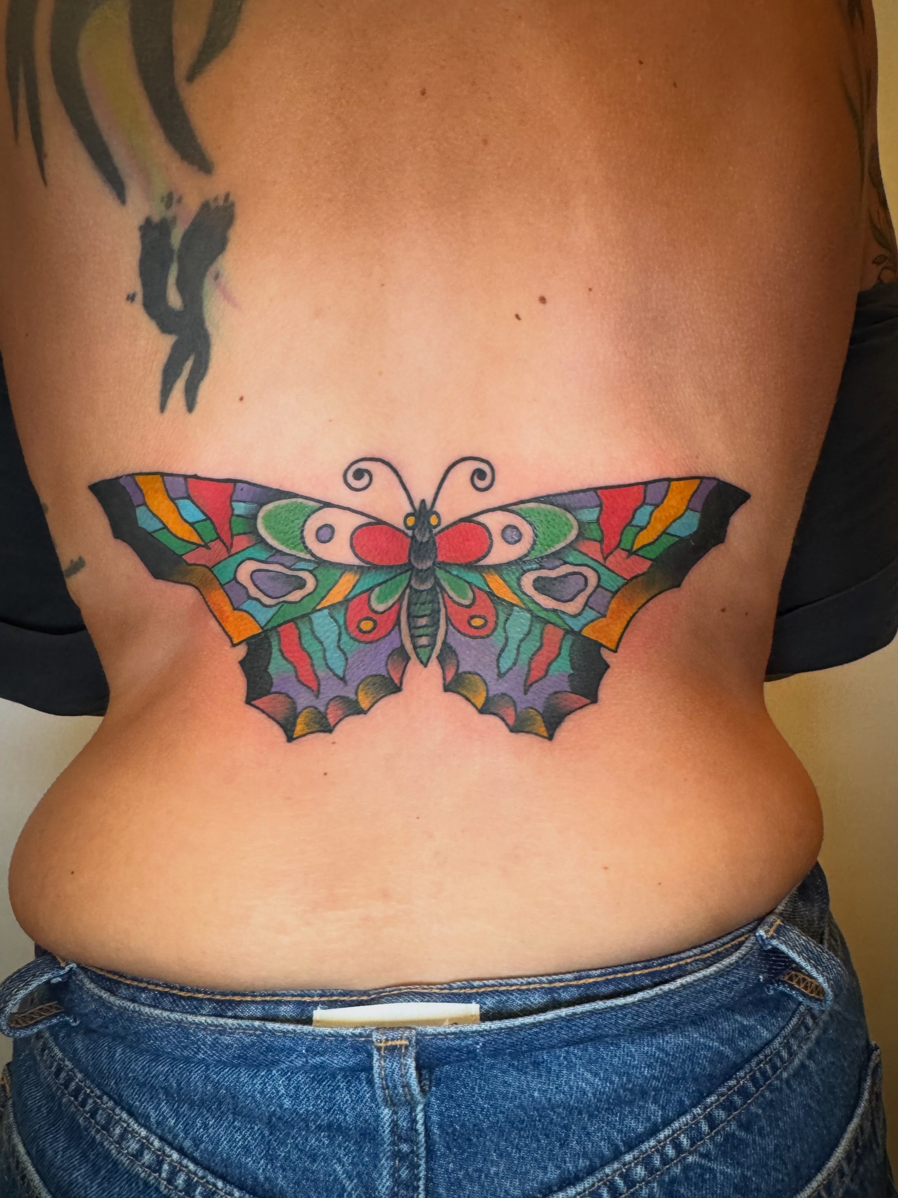 Butterfly new school tattoo on the torso by j Smalley
