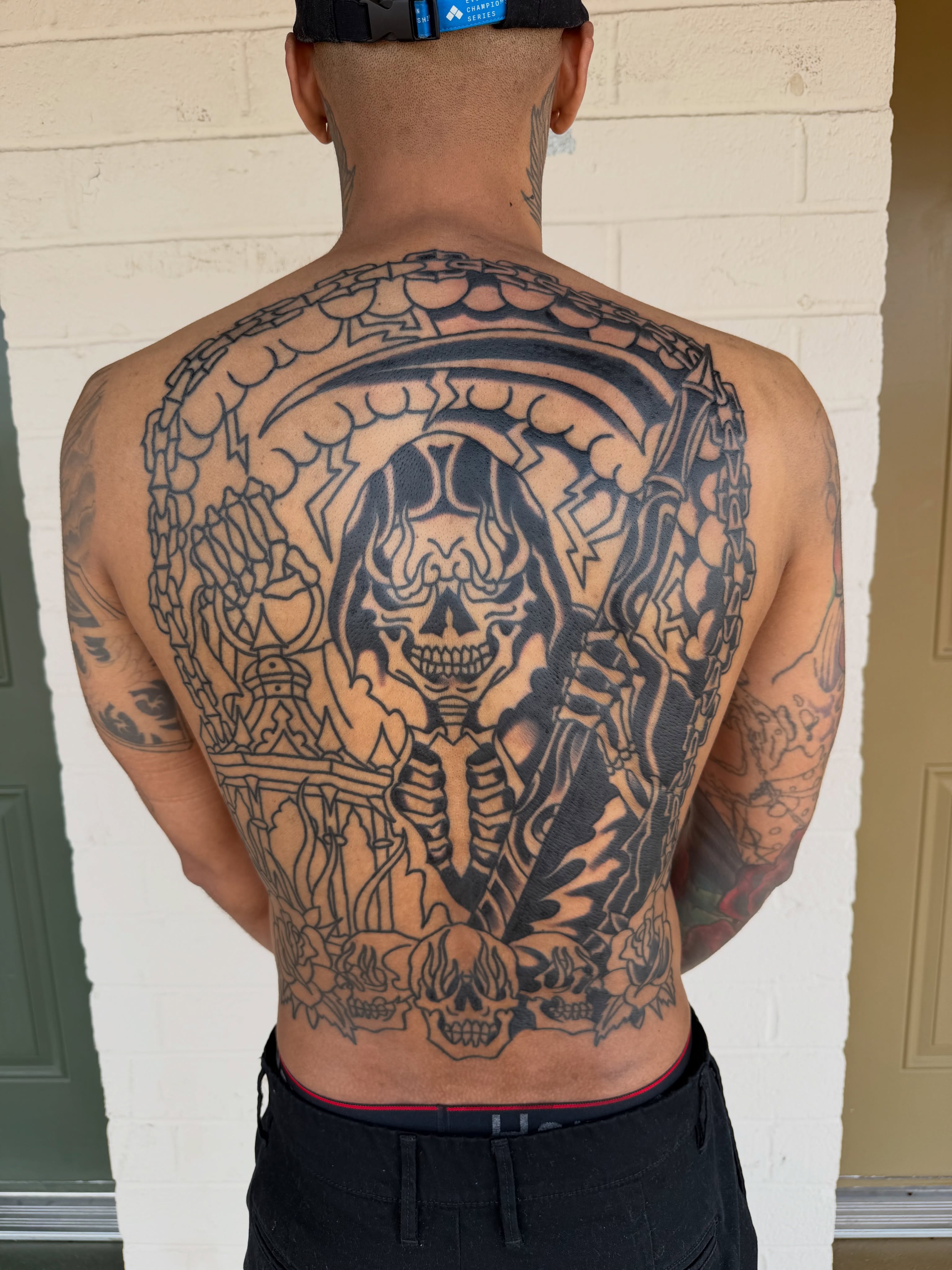 Skull and reaper black and grey tattoo on the back by Kyle Dean Traditional Tattoo Artist