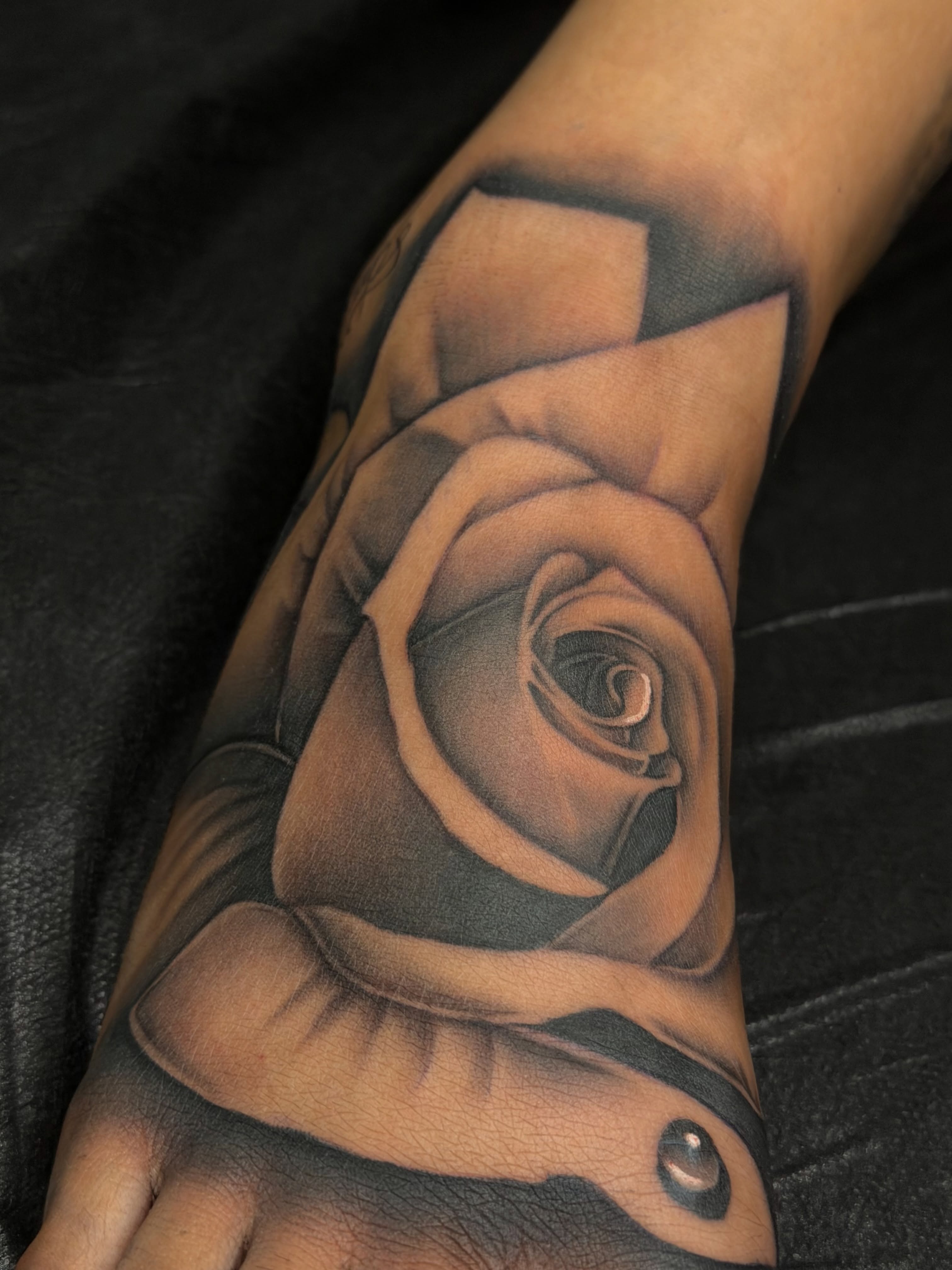 Rose realism tattoo on the forearm by San Diego Tattoo Artist