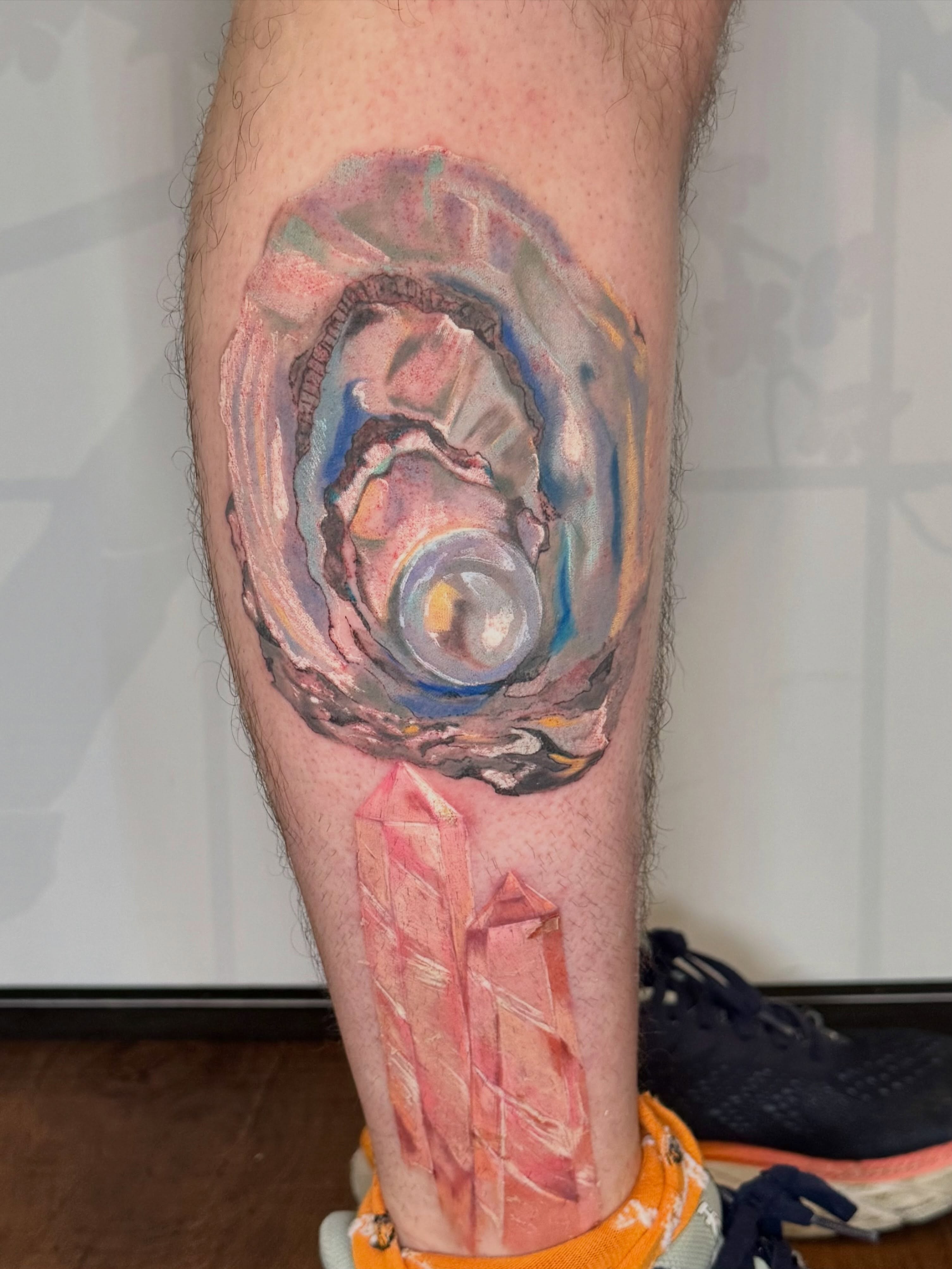 Abstract crystal watercolor tattoo on the leg by Cohen