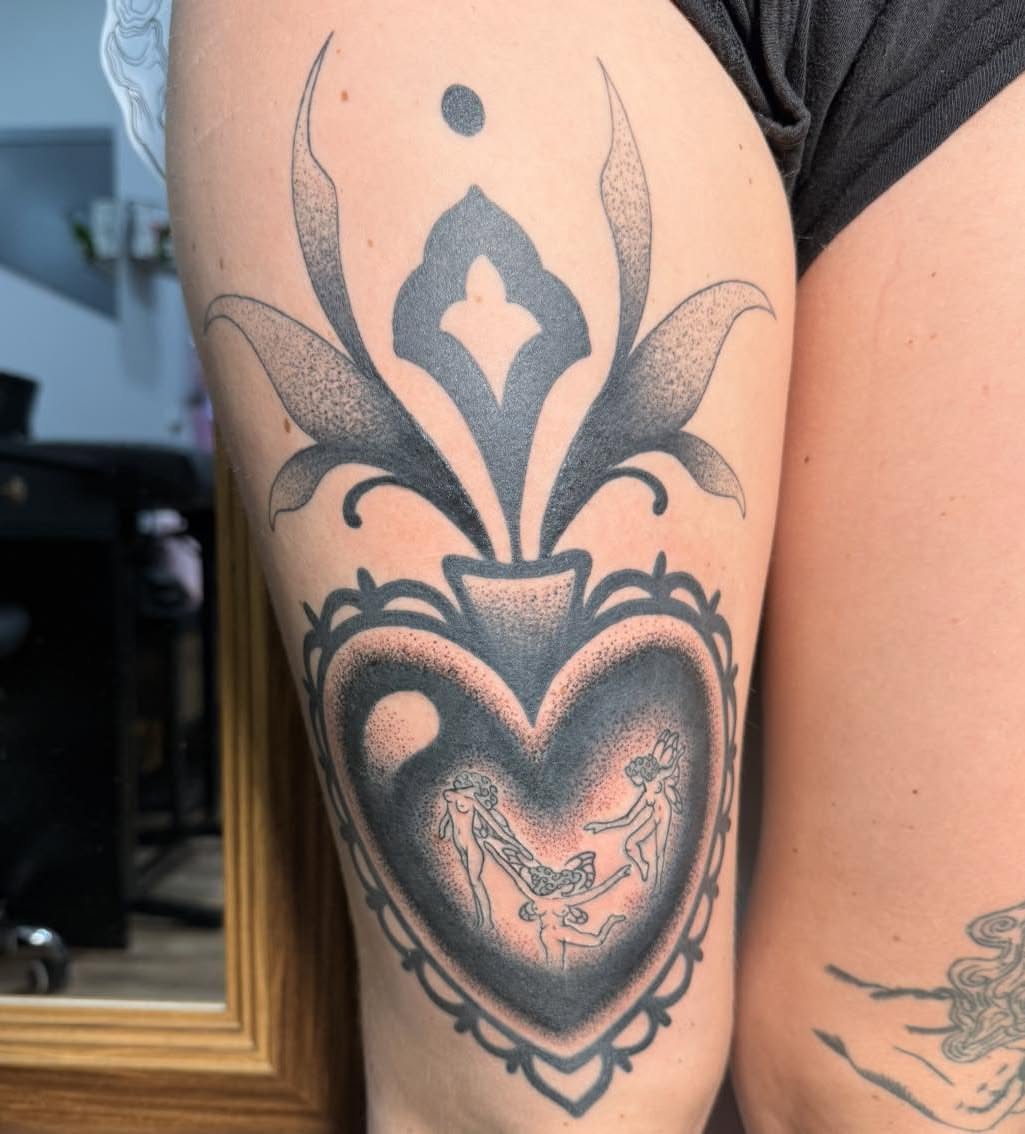 Heart with figures dotwork tattoo on the thigh by Destiny A