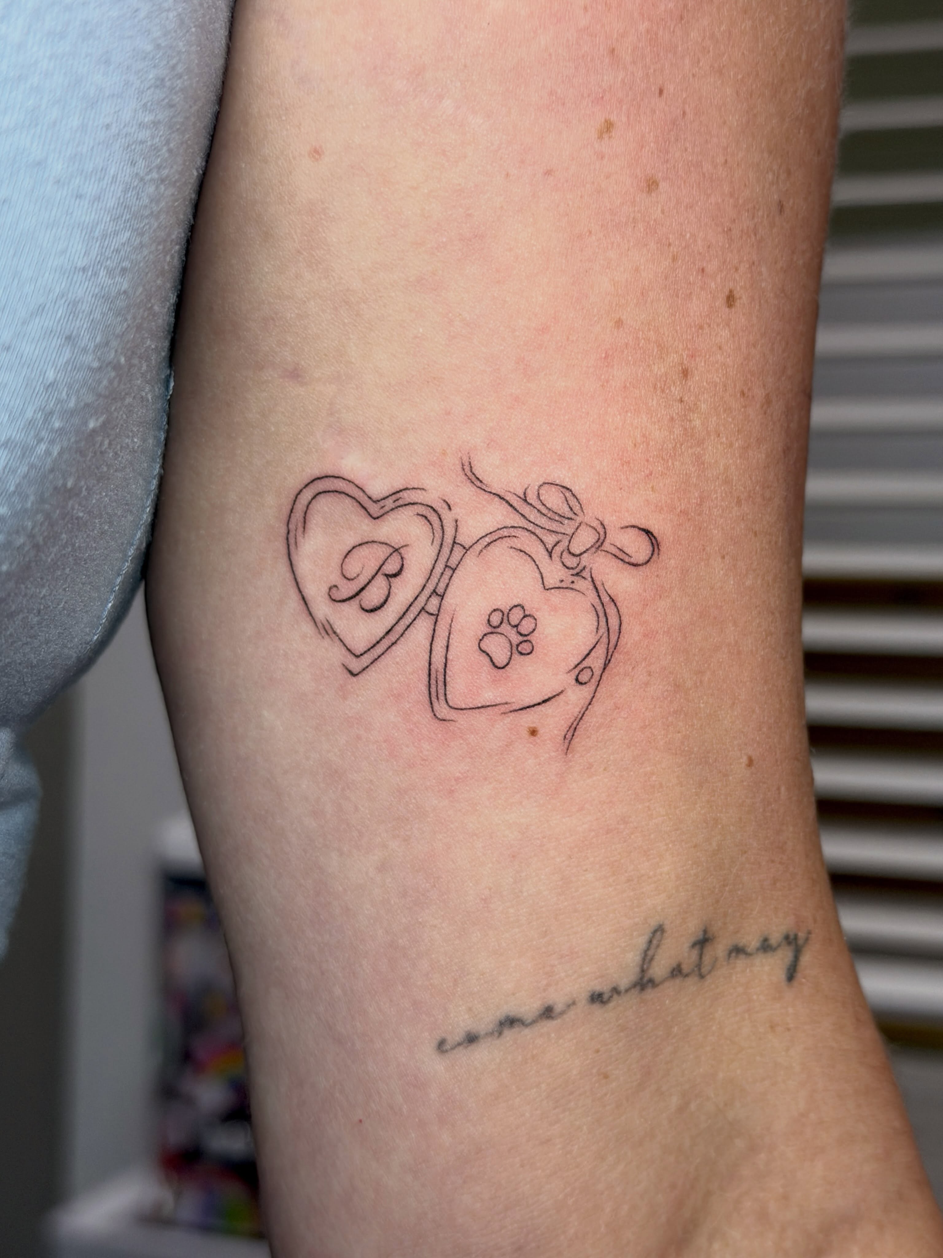 Heart lock and key minimalist tattoo on the forearm by Baka Ink