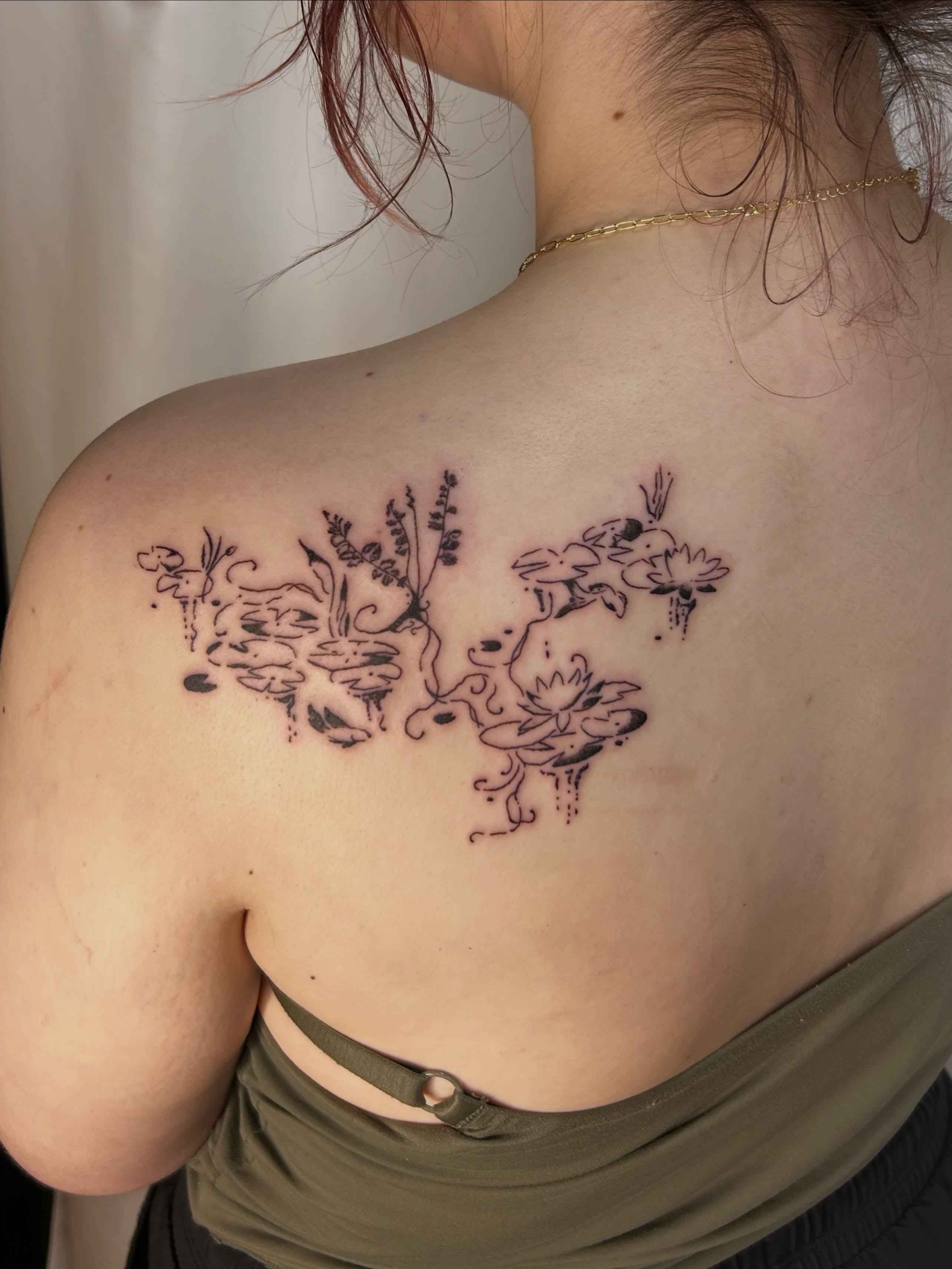Floral arrangement black and grey tattoo on the shoulder by wanderfernfairy