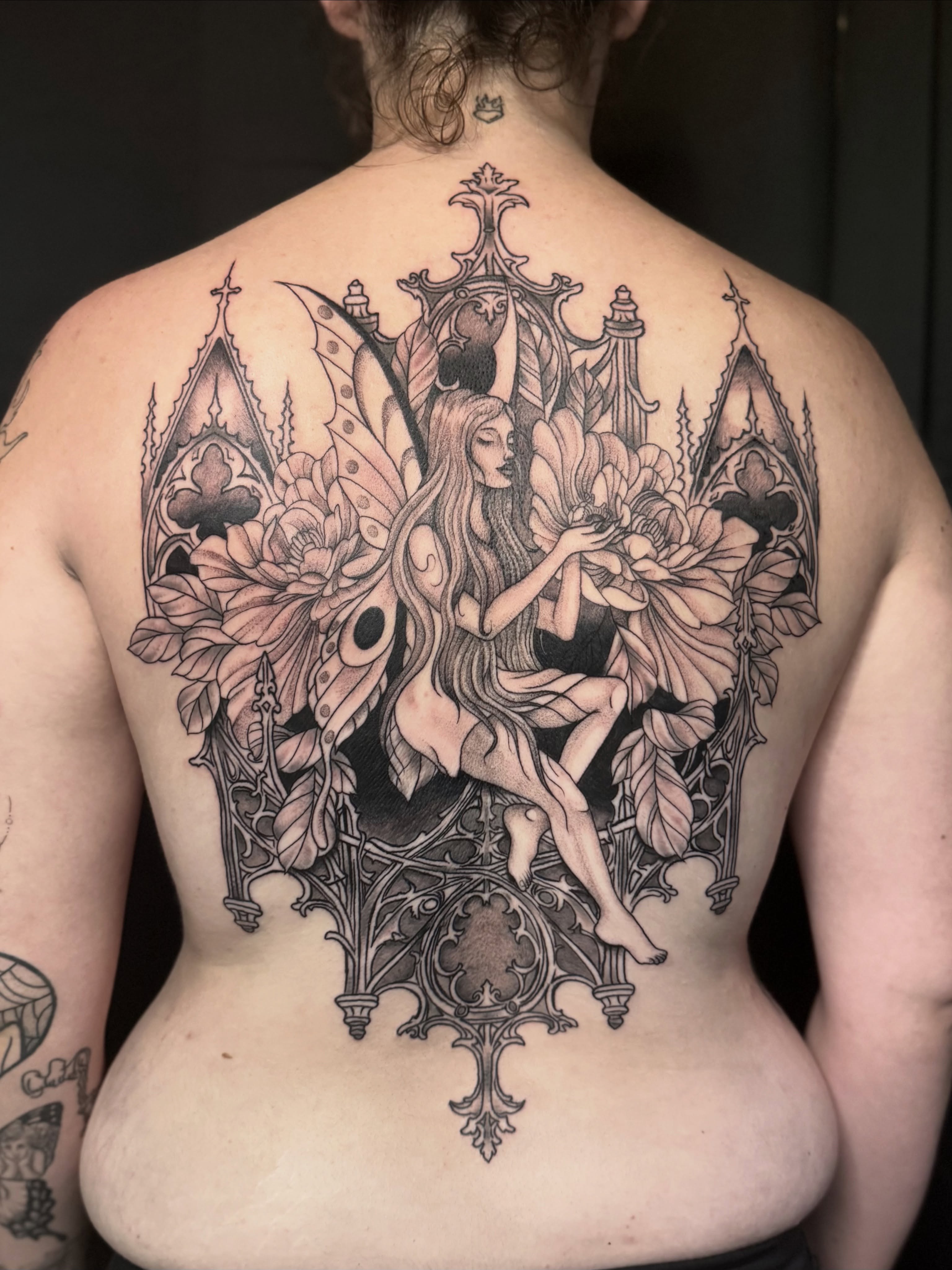 Fairy and gothic architecture illustrative tattoo on the back by Olivia, Royal Oak, Michigan