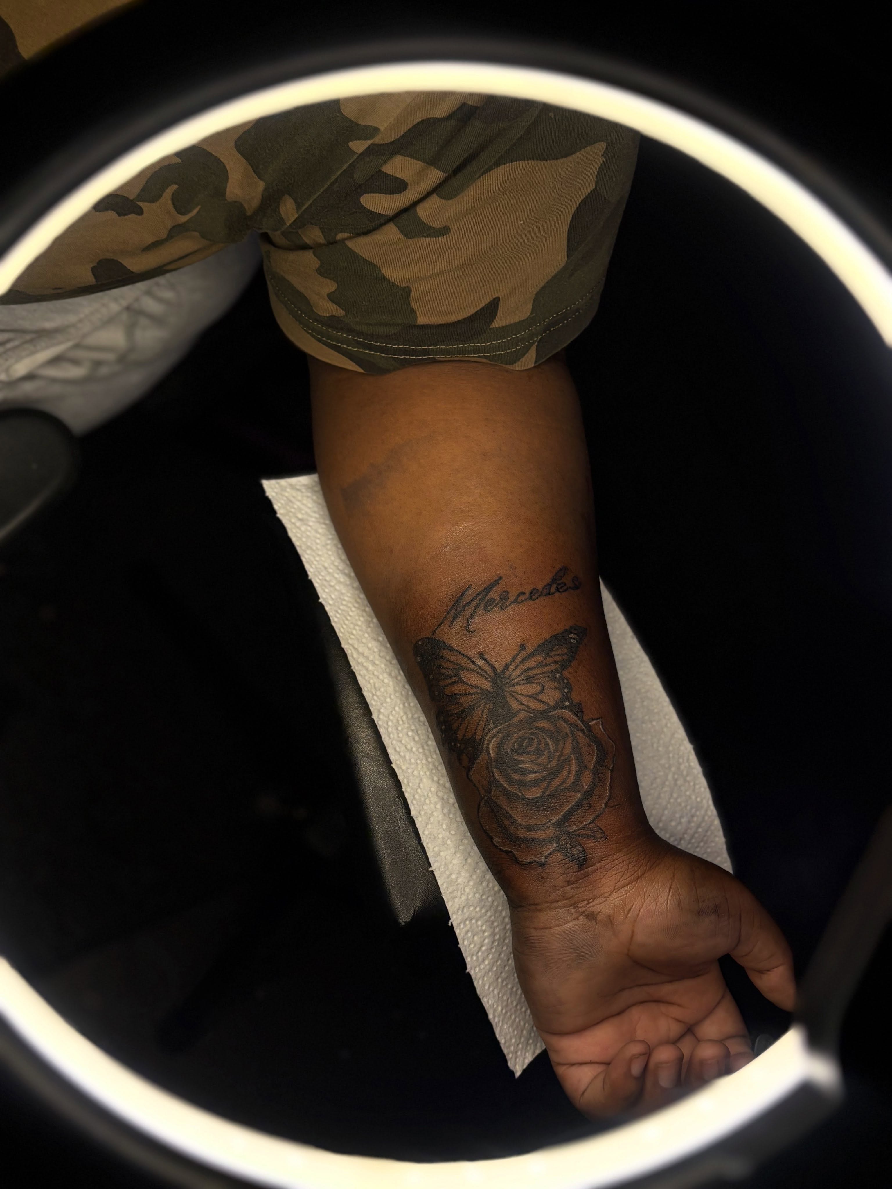 Rose and butterfly black and grey tattoo on the forearm by Winter j
