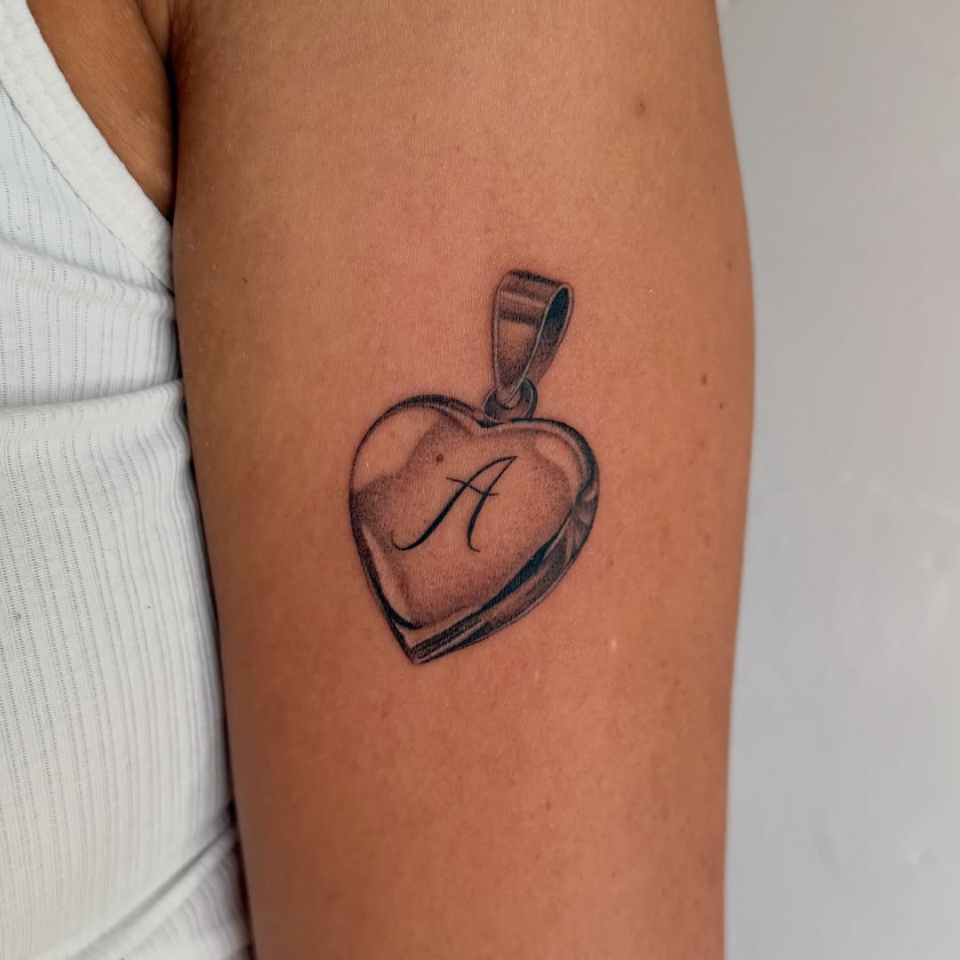 Heart-shaped locket black and grey tattoo on the forearm by 🌼DaisyDaiz🕸️